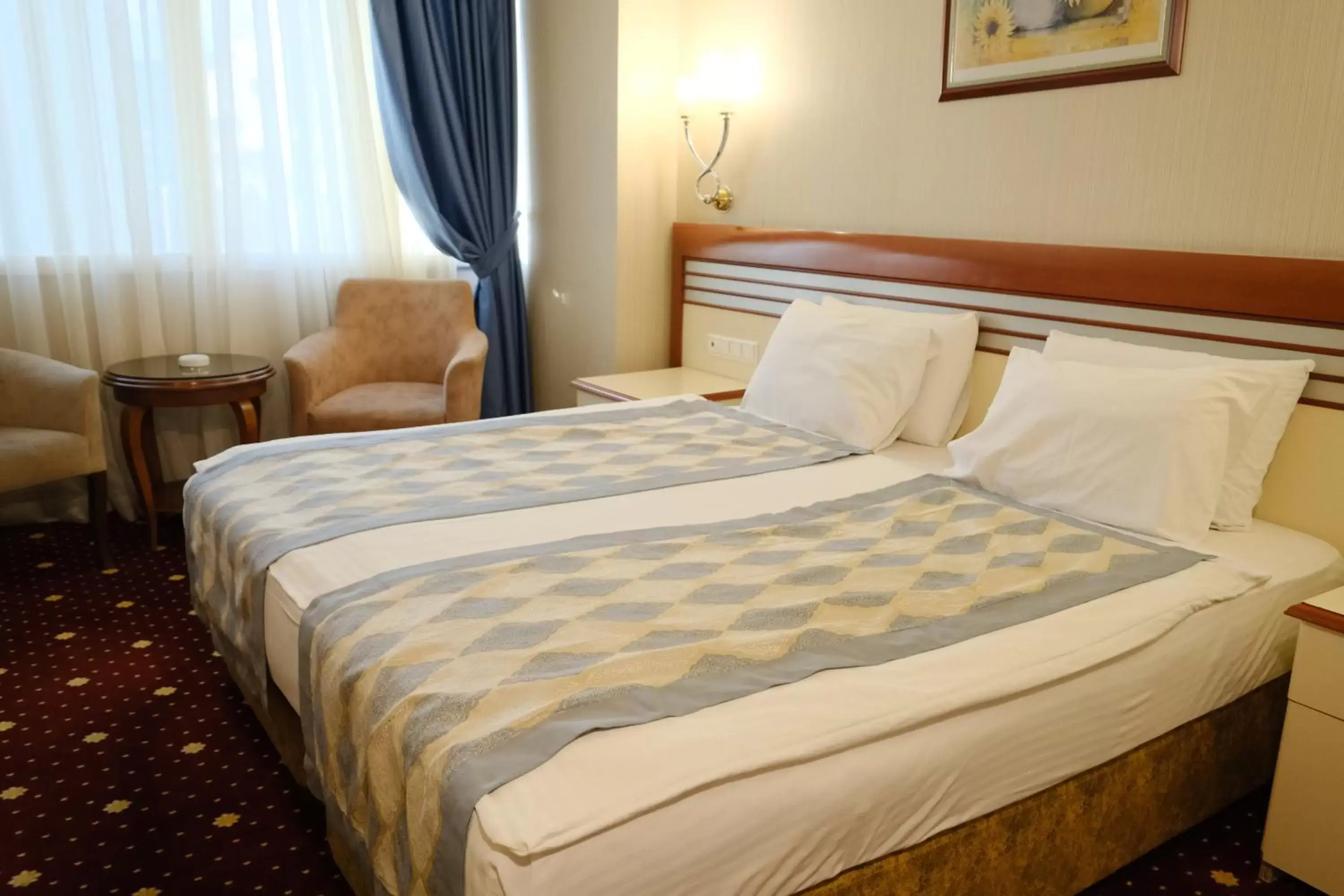 Bed in Akar International Hotel
