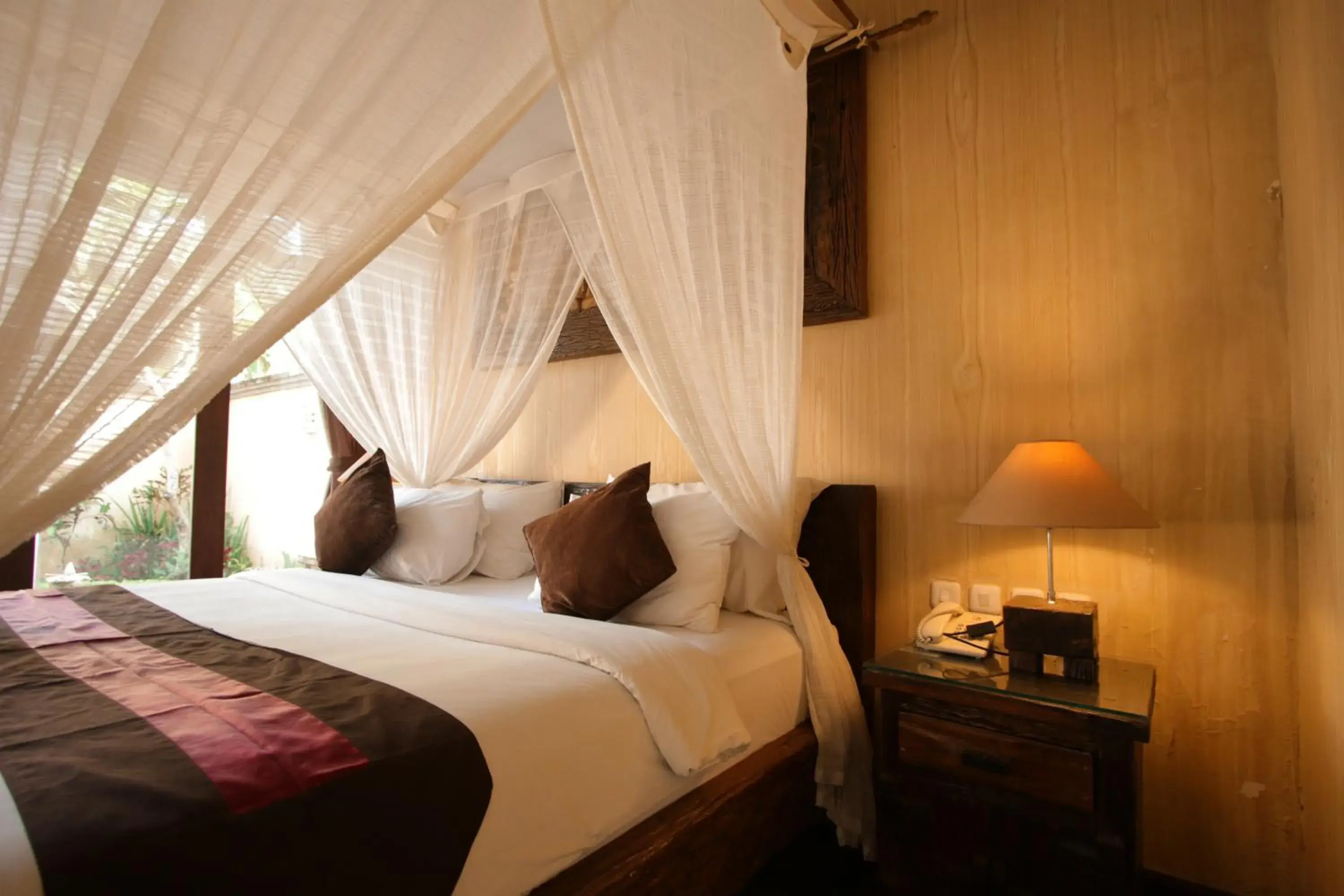 Bed in Gino Feruci Villa Ubud by KAGUM Hotels