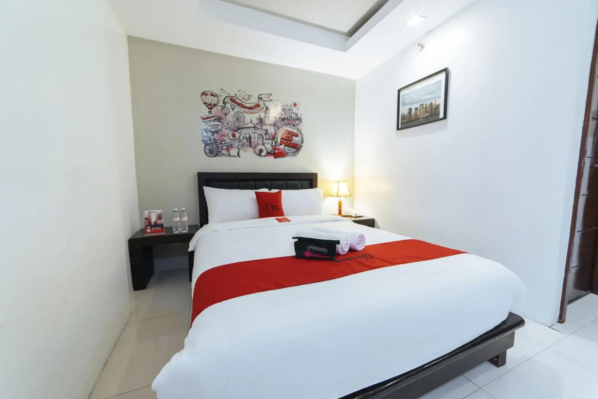 Bedroom, Bed in RedDoorz Plus at One Liberty Hotel Kalayaan Avenue