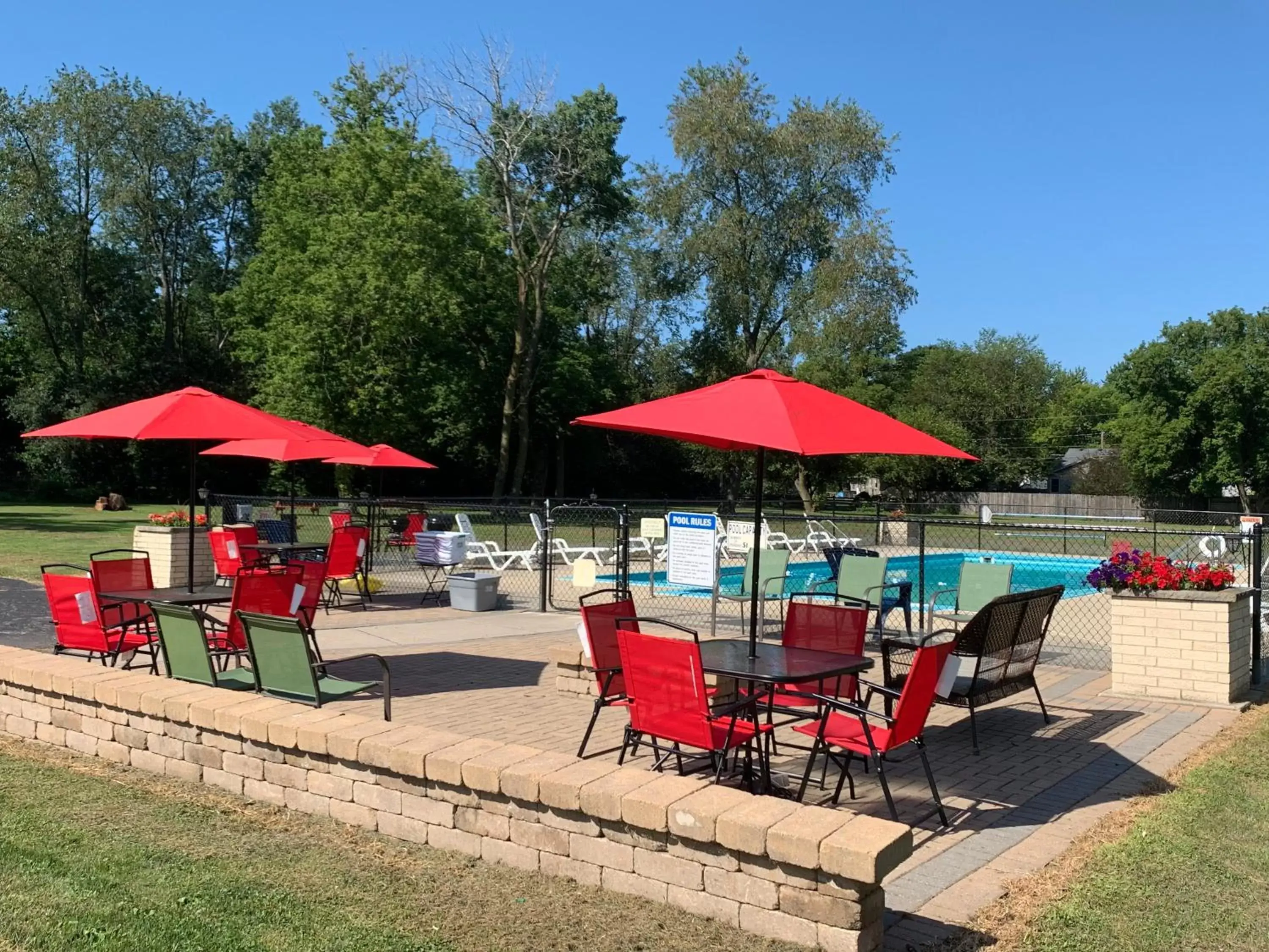 Patio, Swimming Pool in Geneva Wells Motel