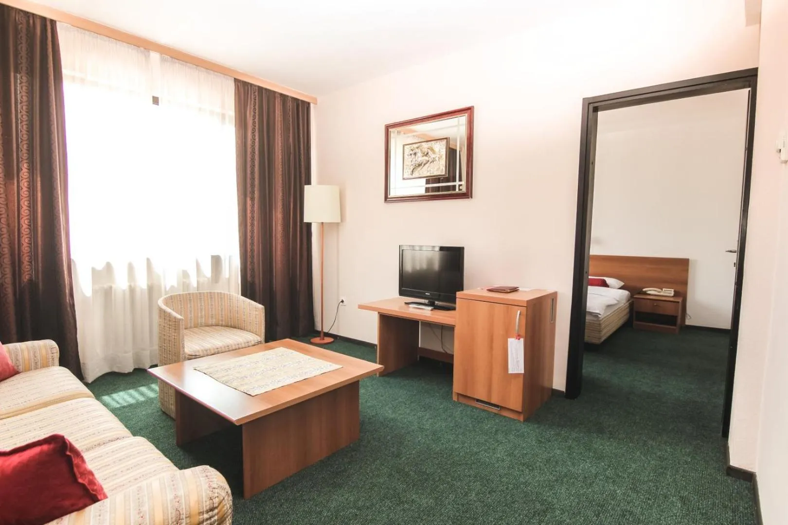 Seating area, Bed in Hotel Grand