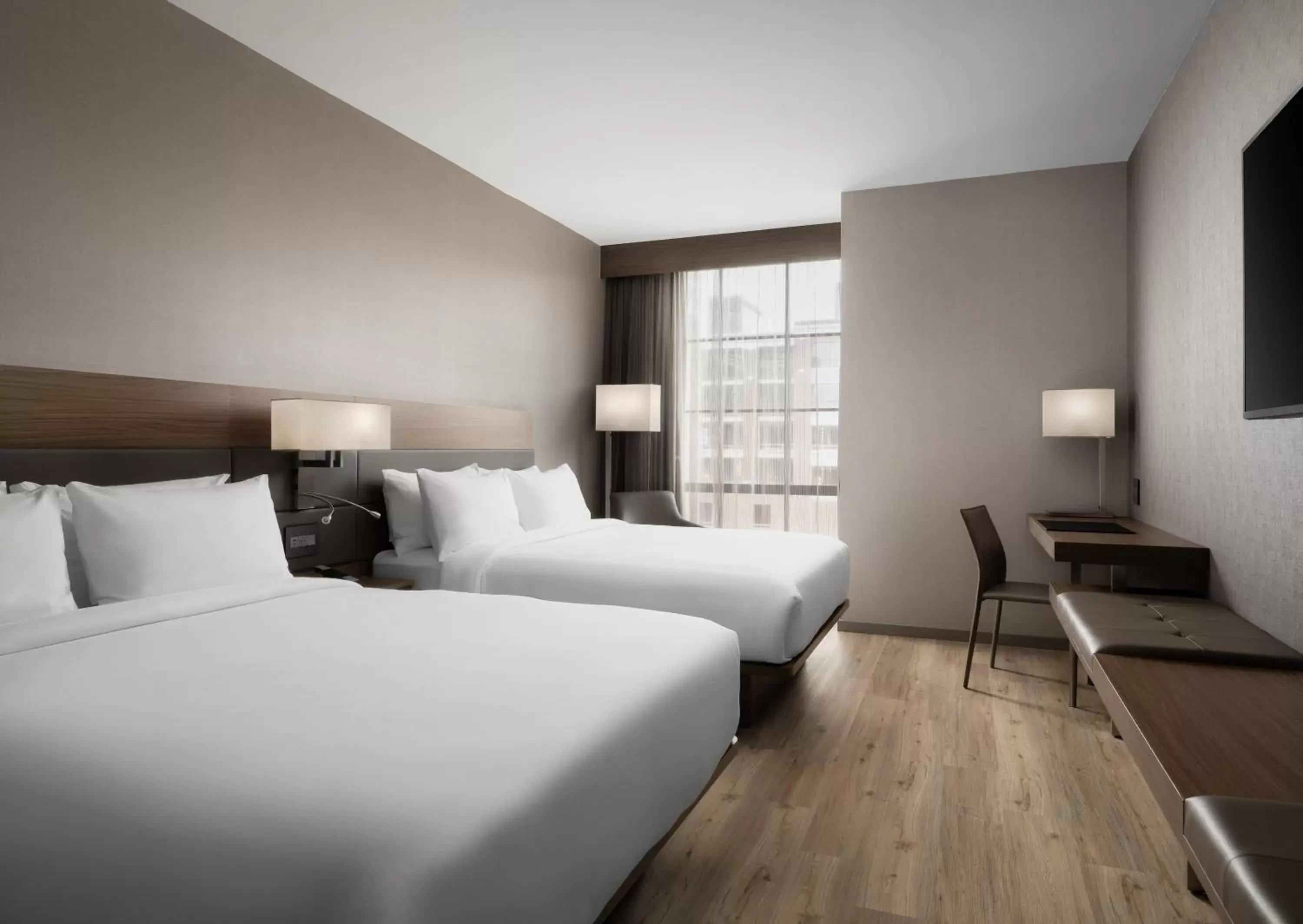 Bed in AC Hotel by Marriott Dayton