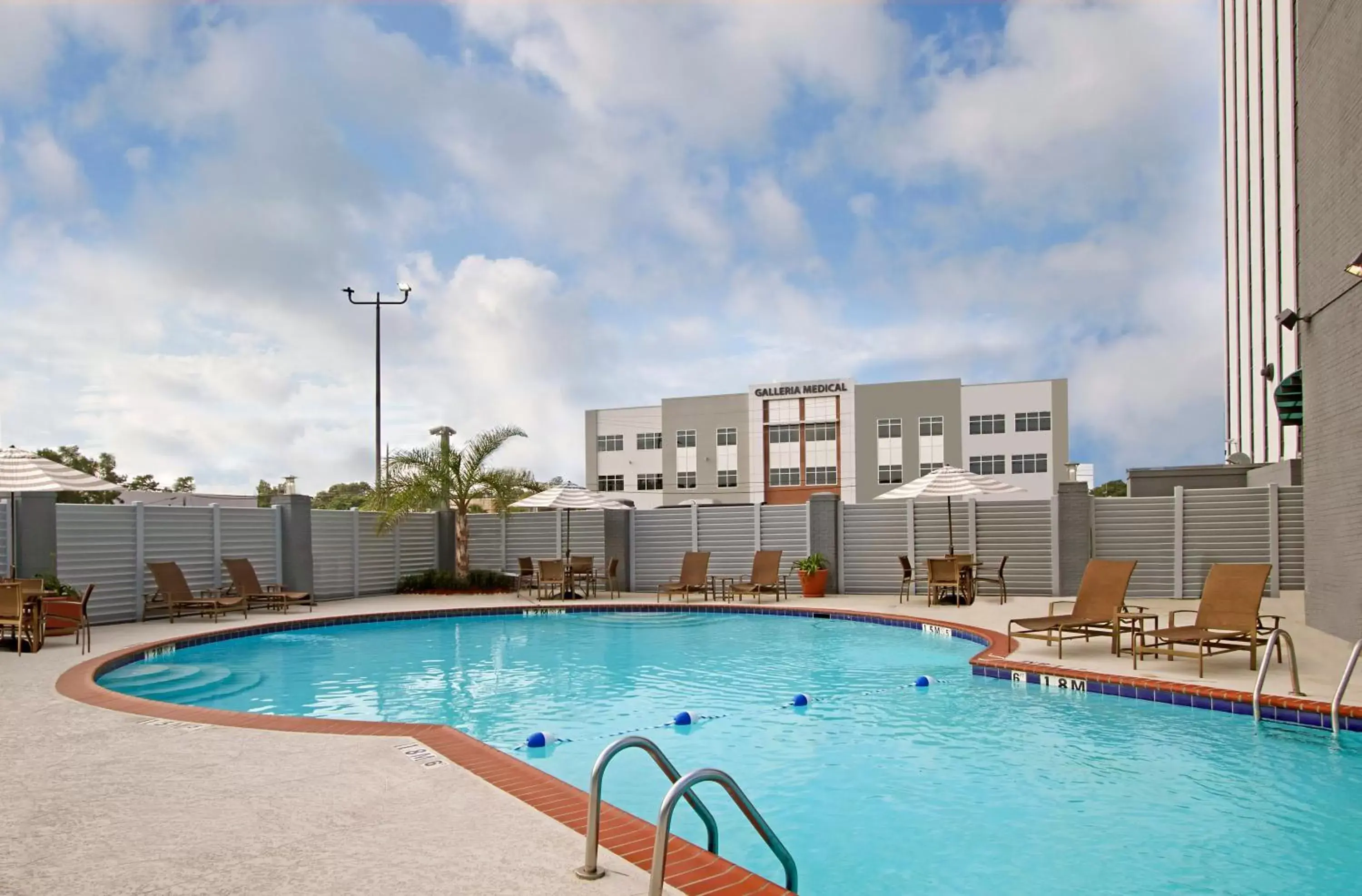 Swimming Pool in Holiday Inn Metairie New Orleans, an IHG Hotel