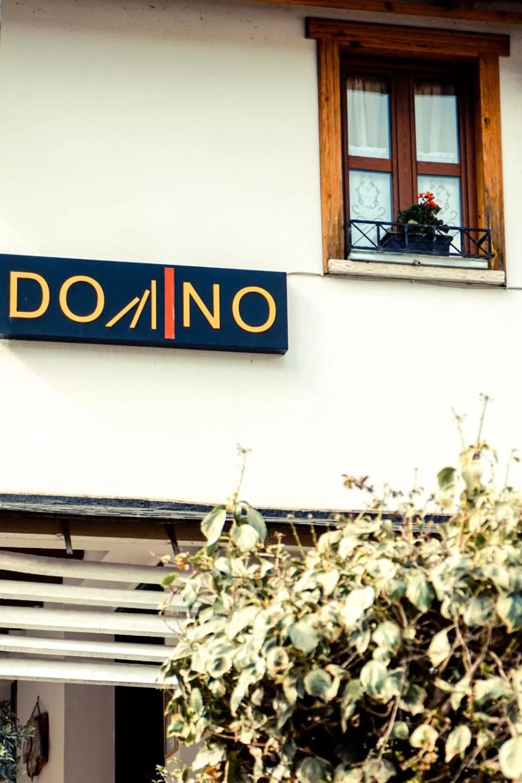 Property logo or sign in Hotel Domino