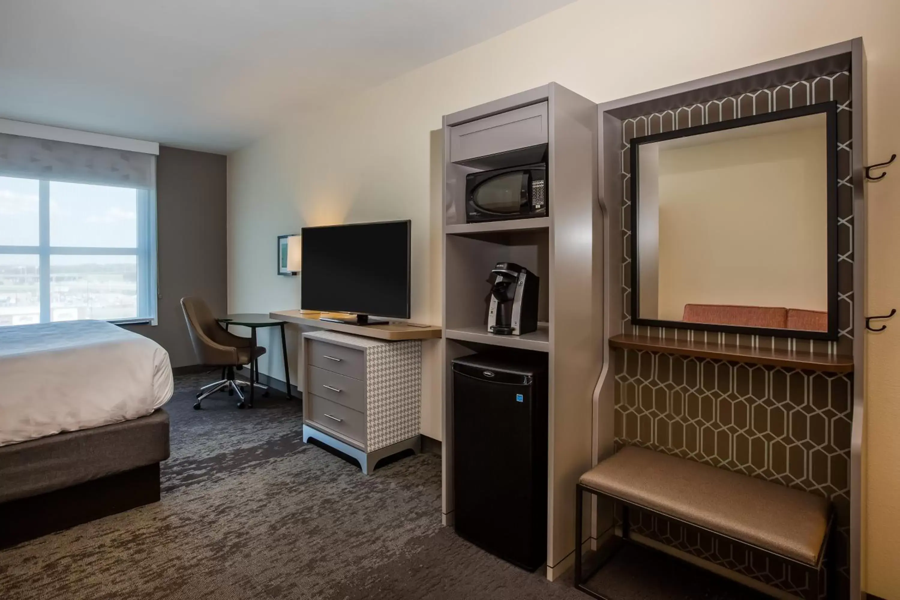 Photo of the whole room, TV/Entertainment Center in Holiday Inn - Gulfport-Airport, an IHG Hotel