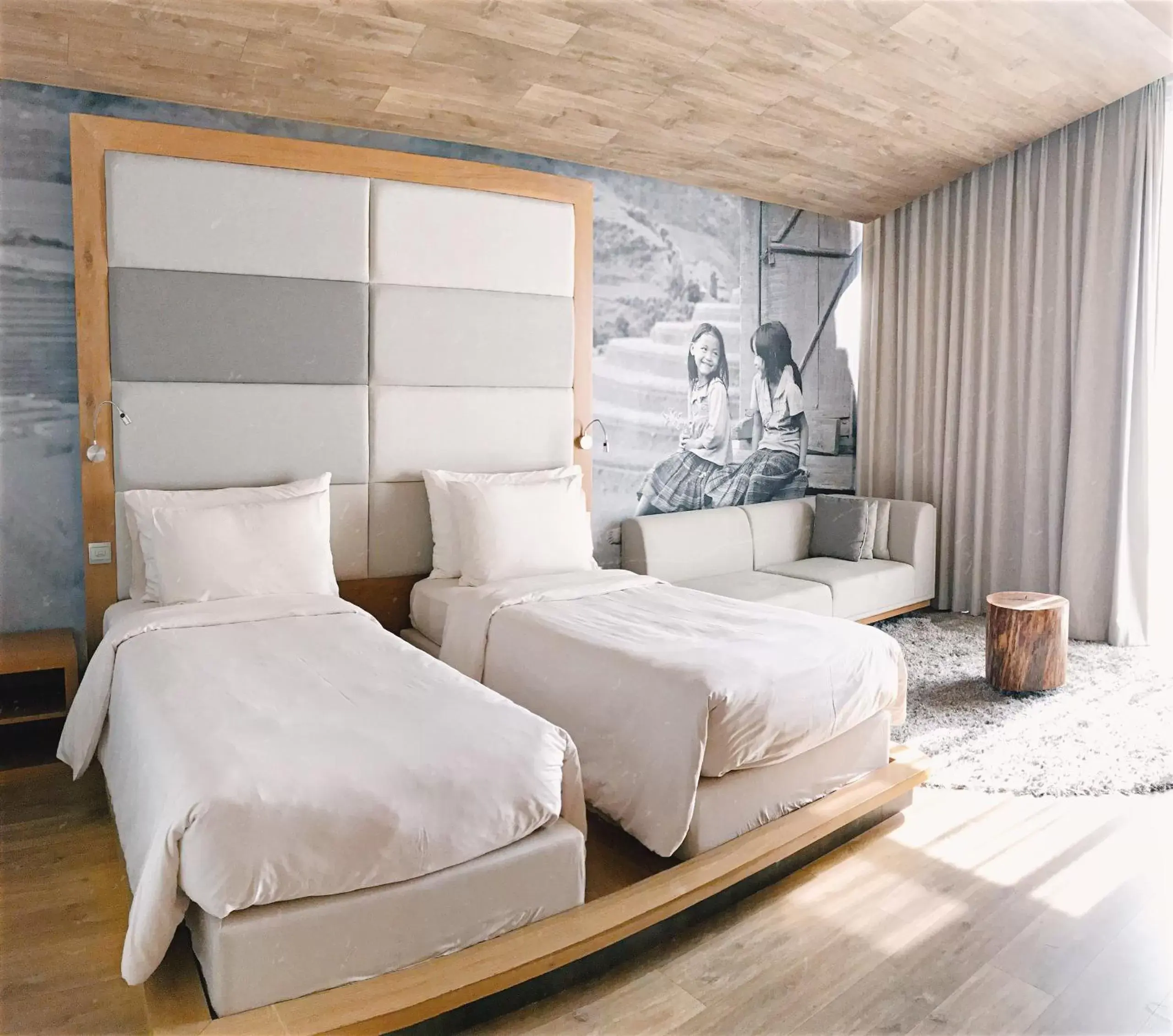 Seating area, Bed in Fusion Suites Saigon Seating area, Bed in Fusion Suites Saigon