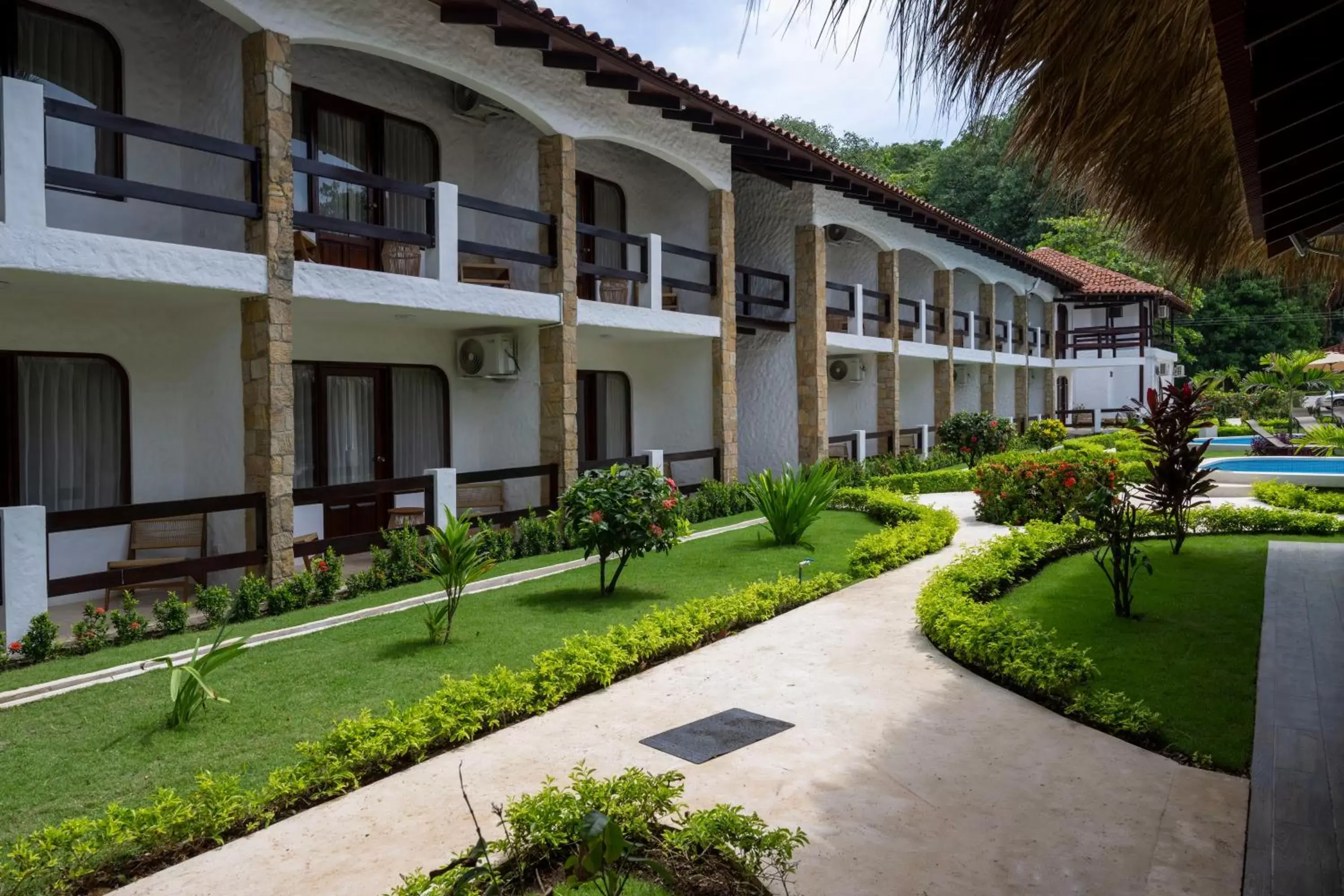 Garden view, Property Building in Fuego del Sol Beachfront Hotel