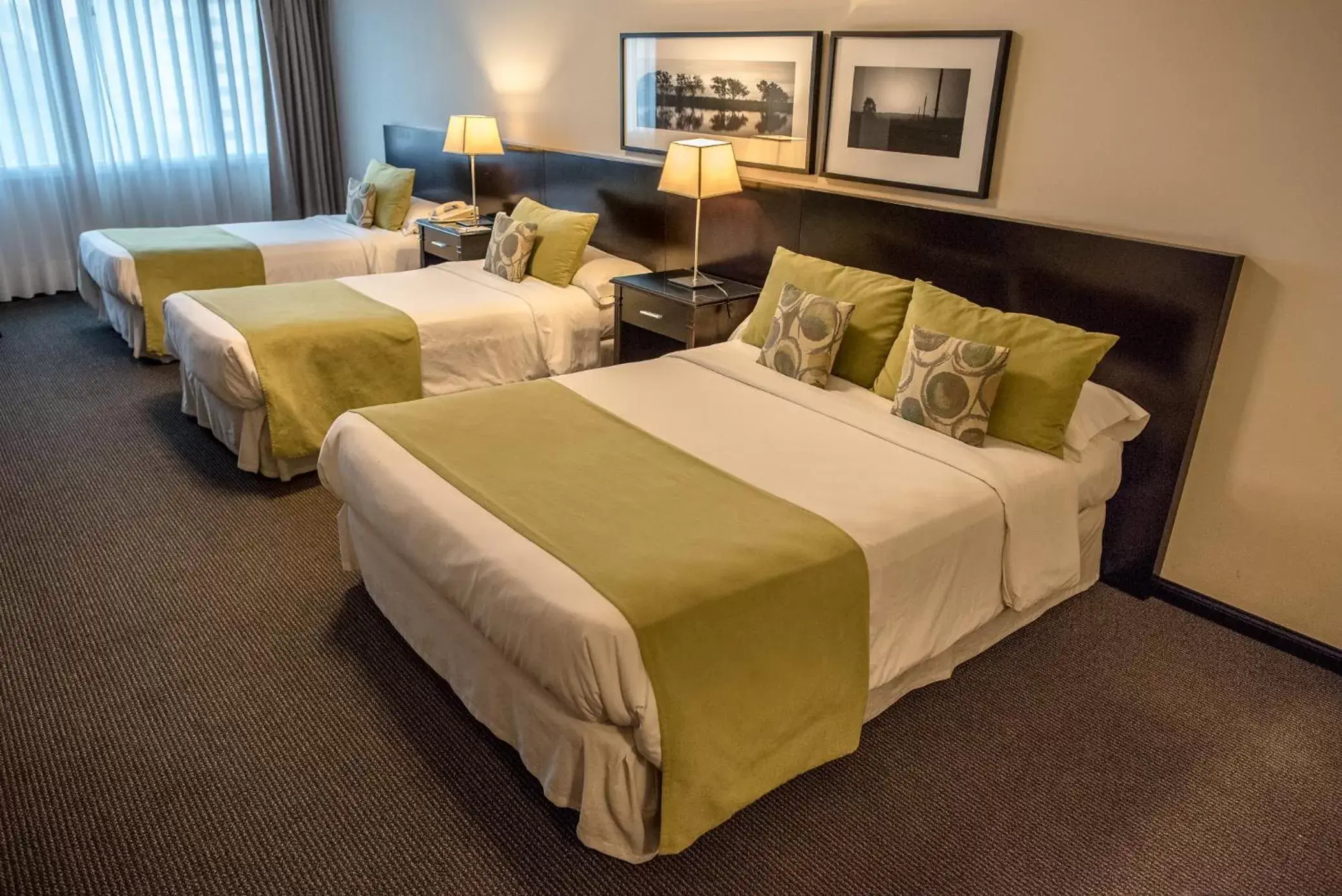 Photo of the whole room, Bed in Plaza Real Suites Hotel