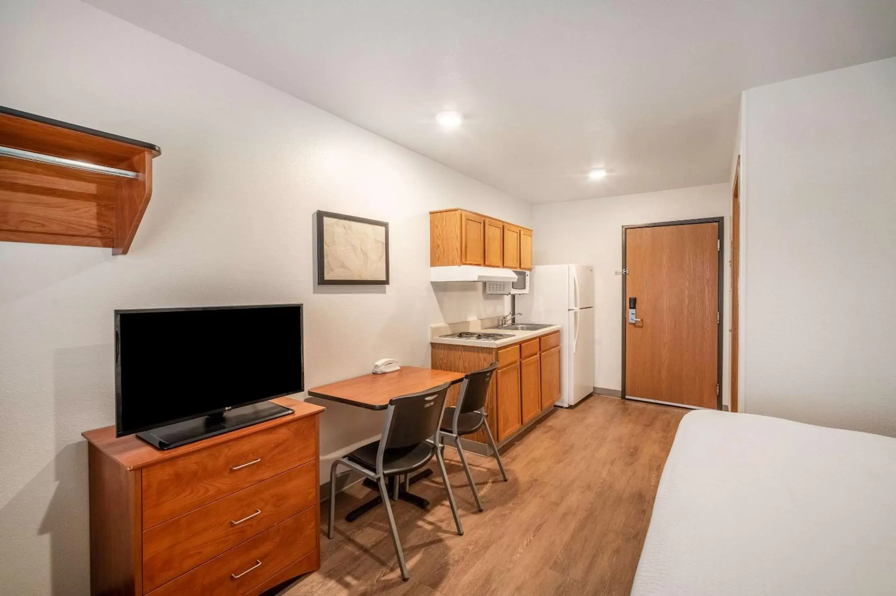 Photo of the whole room, TV/Entertainment Center in WoodSpring Suites Corpus Christi