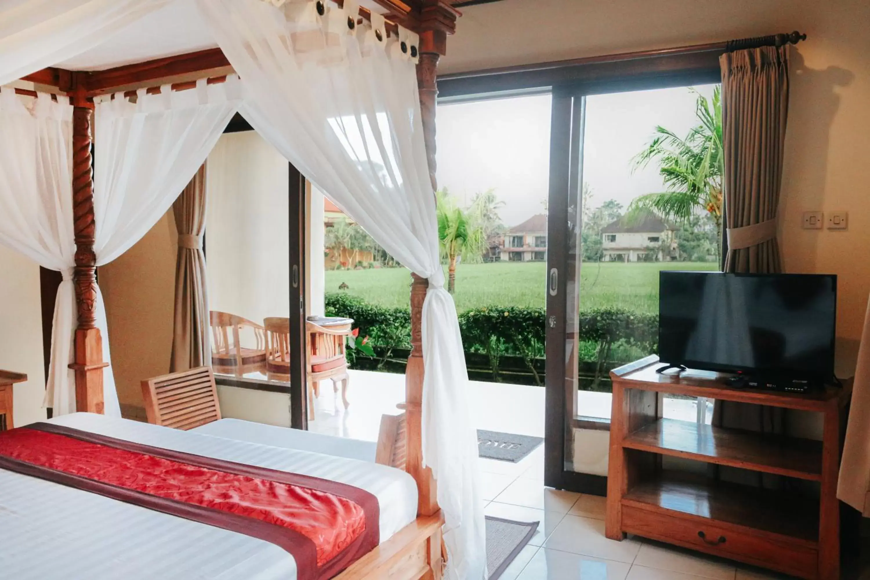 Bed, TV/Entertainment Center in Sri Aksata Ubud Resort by Adyatma Hospitality