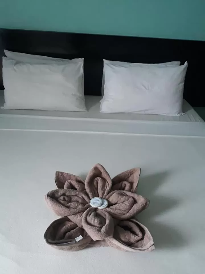 Bed in Coron Visitors Hotel