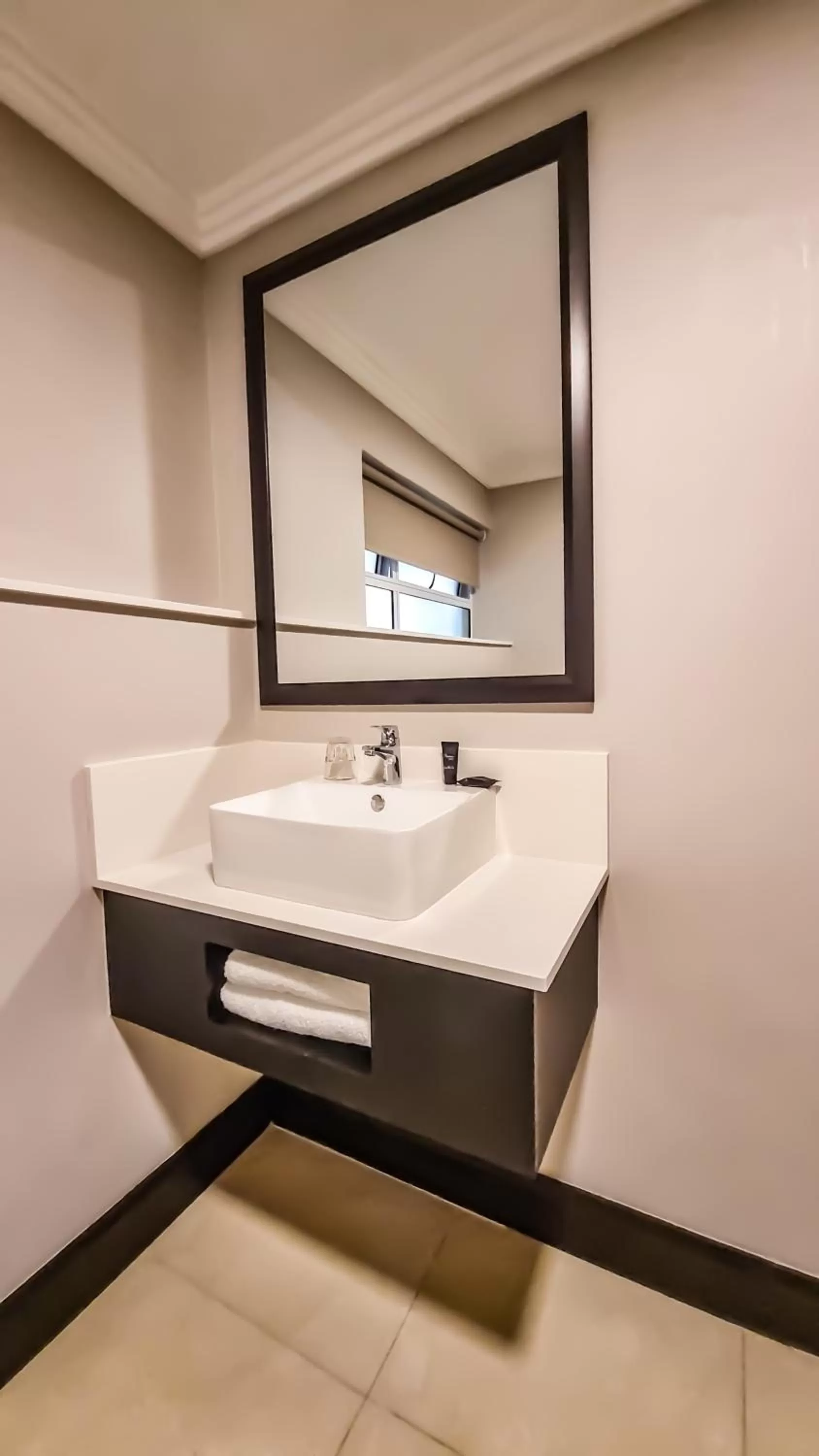 Bathroom in Belaire Suites Hotel