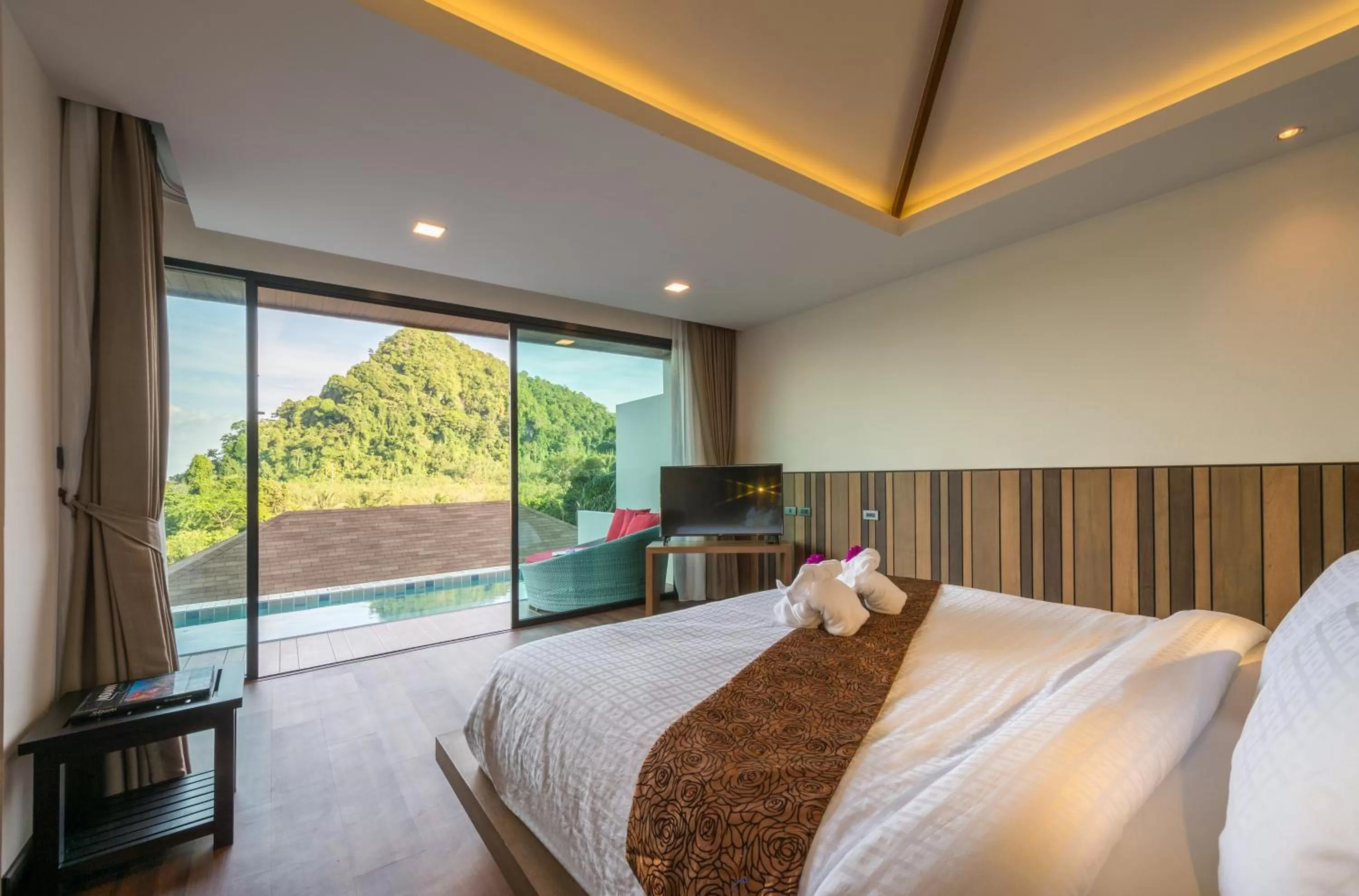 Bed in Cher​mantra​ Aonang​ Resort & Pool​ Suite