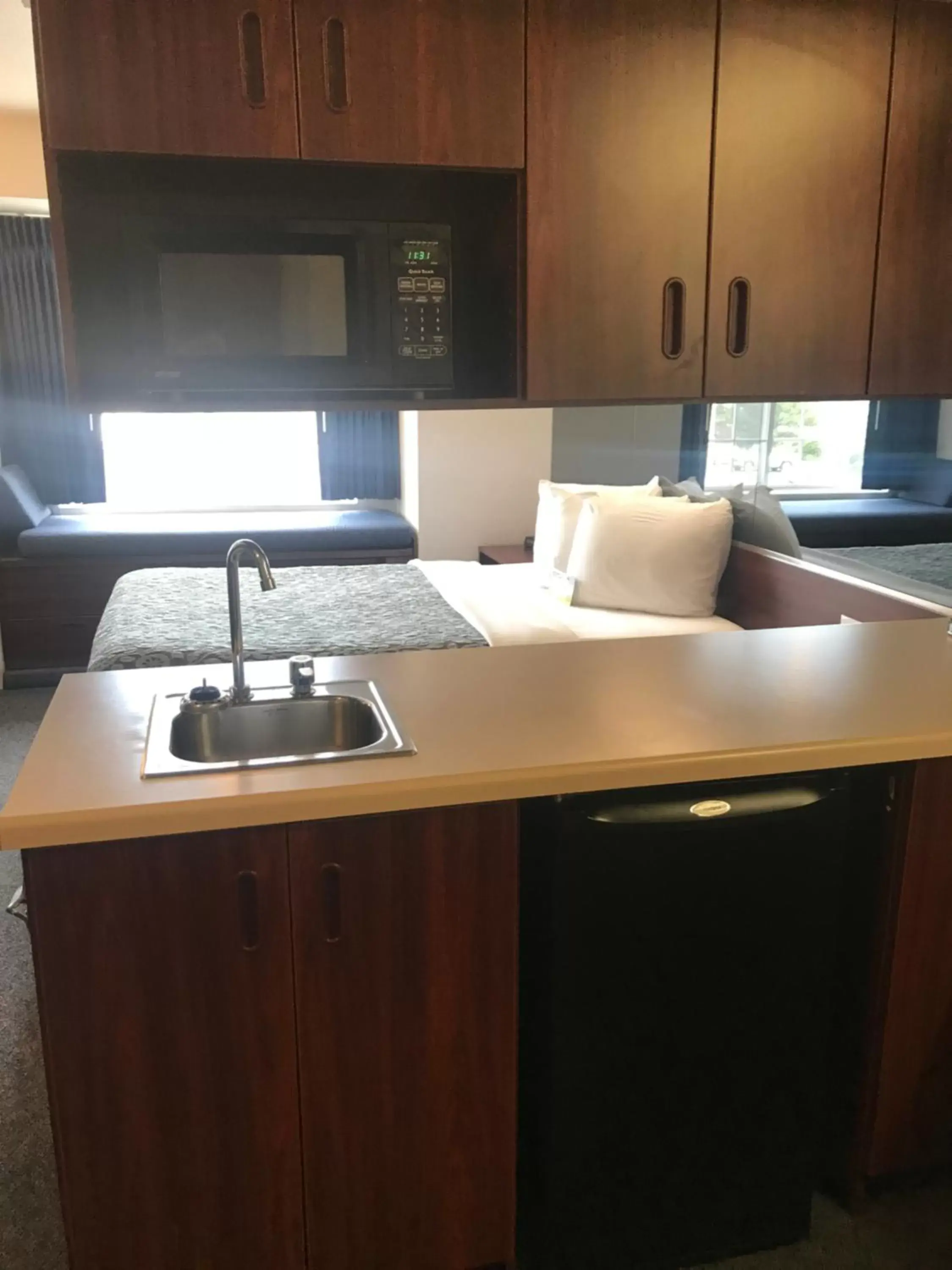 Kitchen/Kitchenette in Days Inn & Suites by Wyndham Greeley