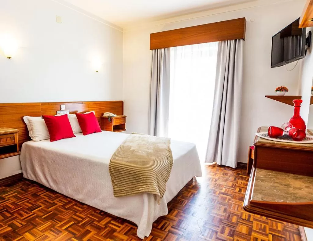 Bed in Dona Amélia Hotel by RIDAN Hotels