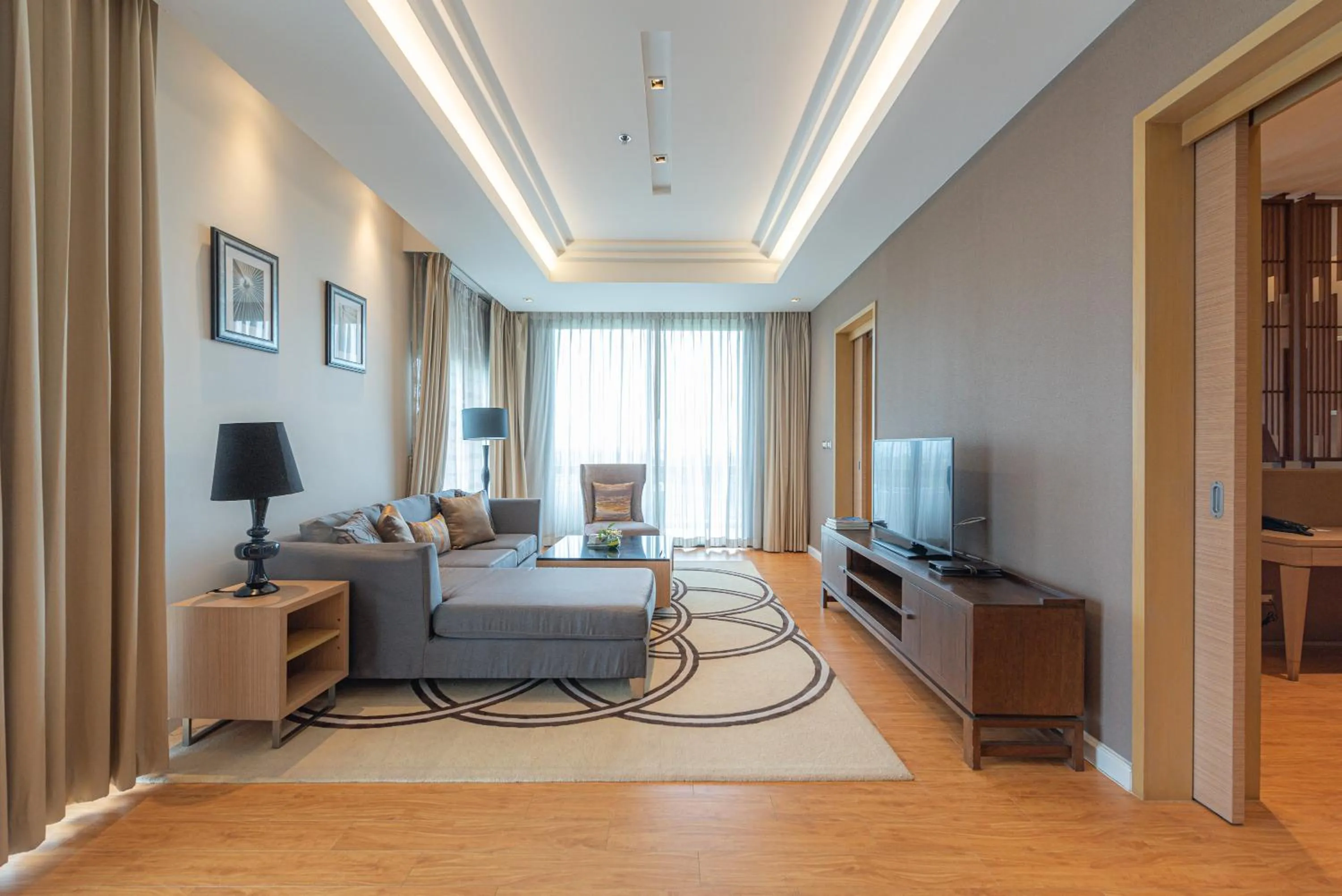 Living room in Summit Windmill Golf Suite Hotel at Suvarnabhumi