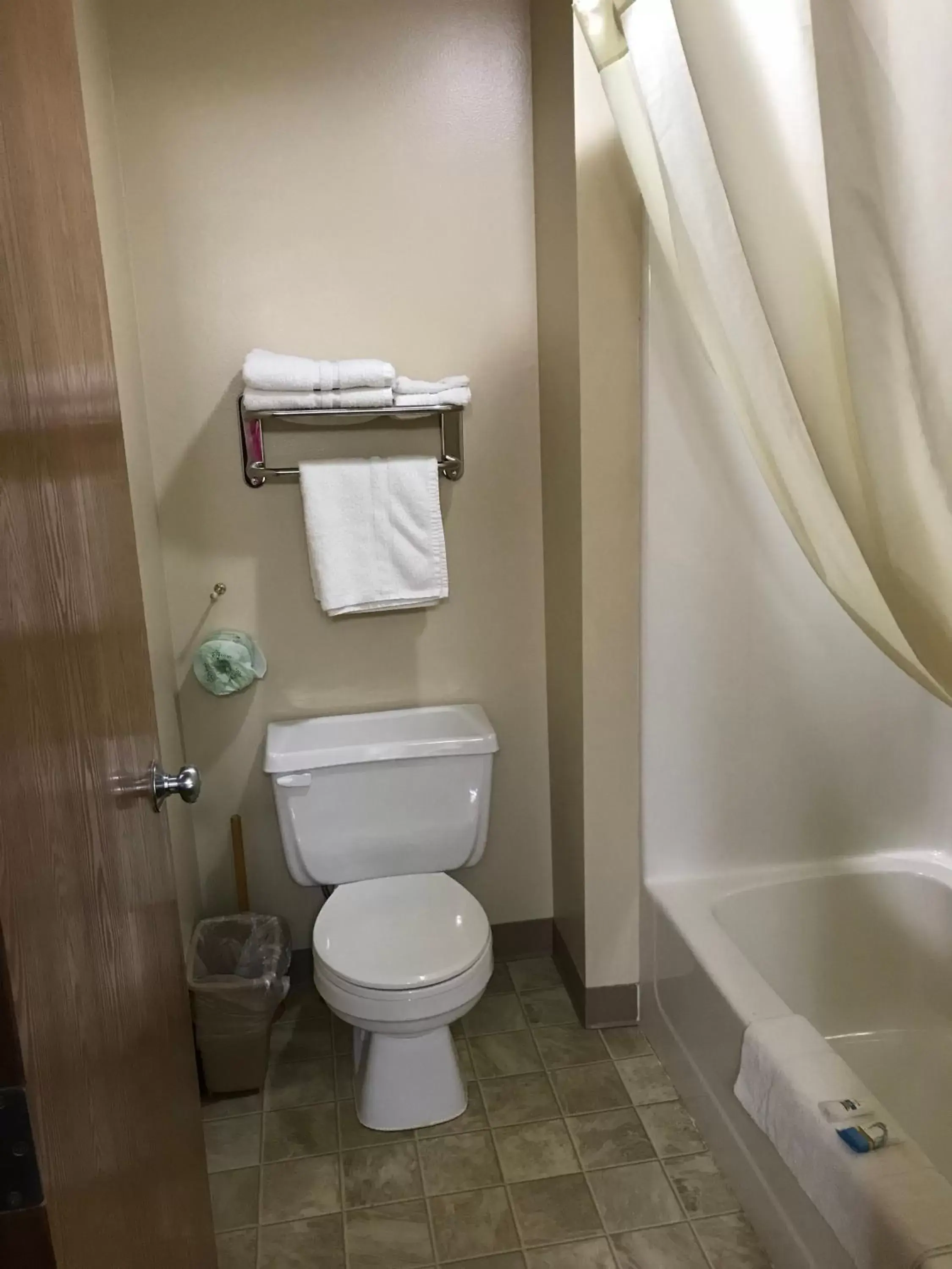 Toilet, Bathroom in Heartland Hotel & Suites