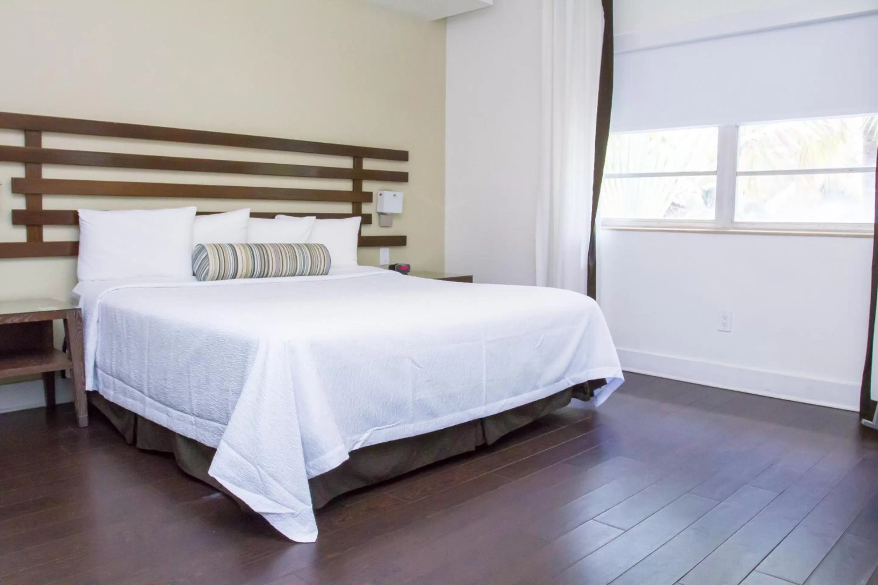 Bed in Dorchester Hotel & Suites