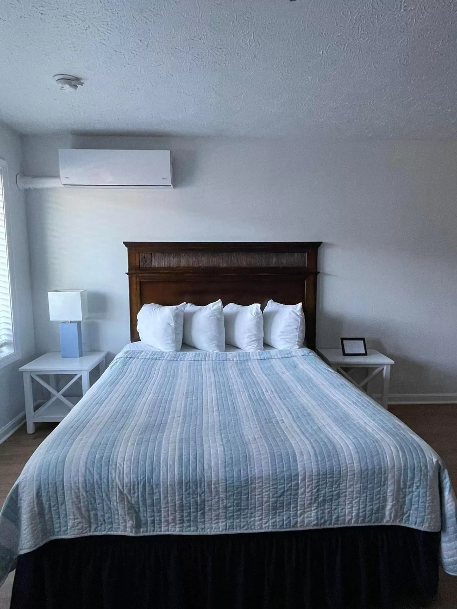 Bed in The Grand Beach Inn