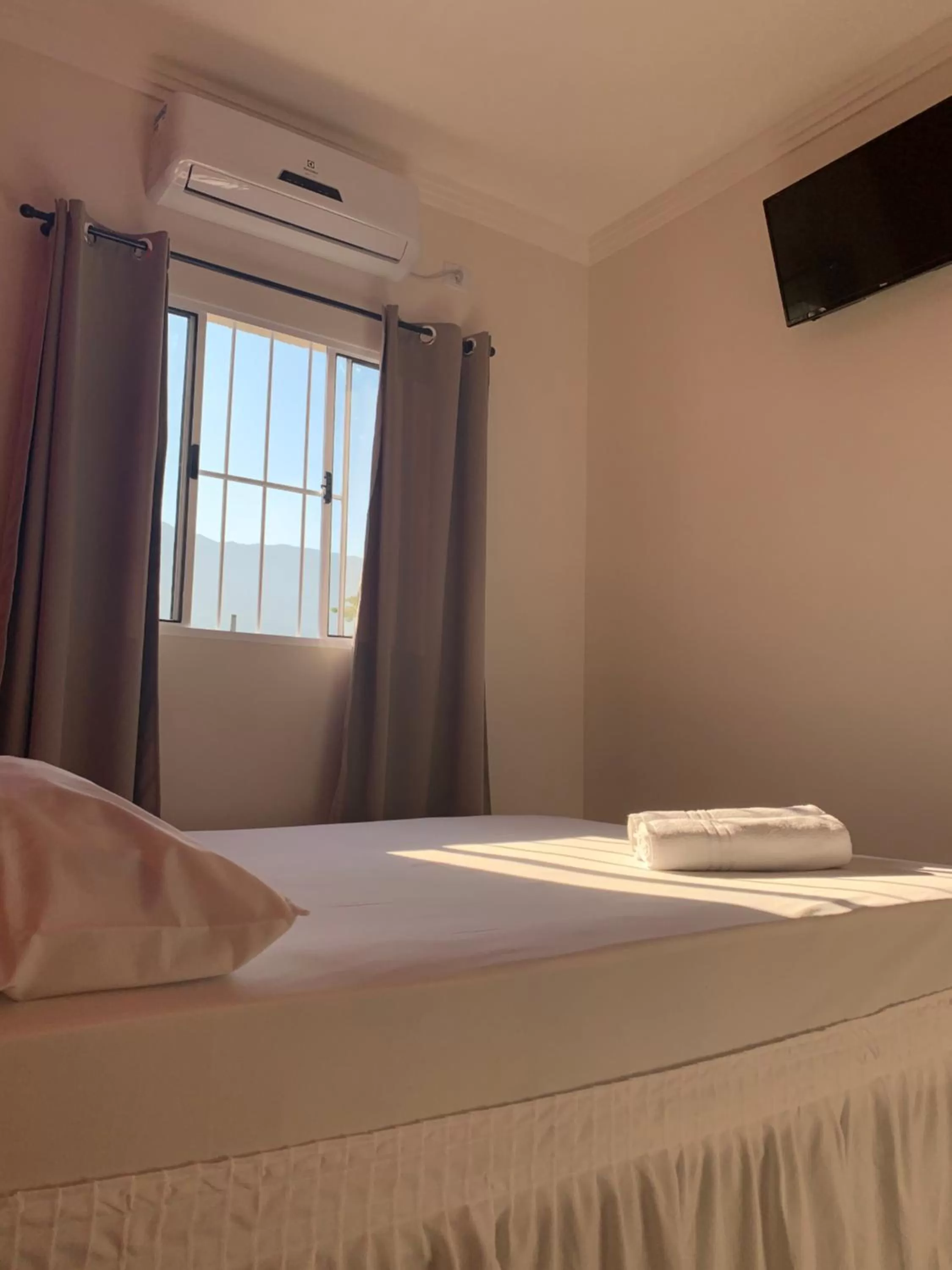 Bed in Pousada Recanto Som do Mar