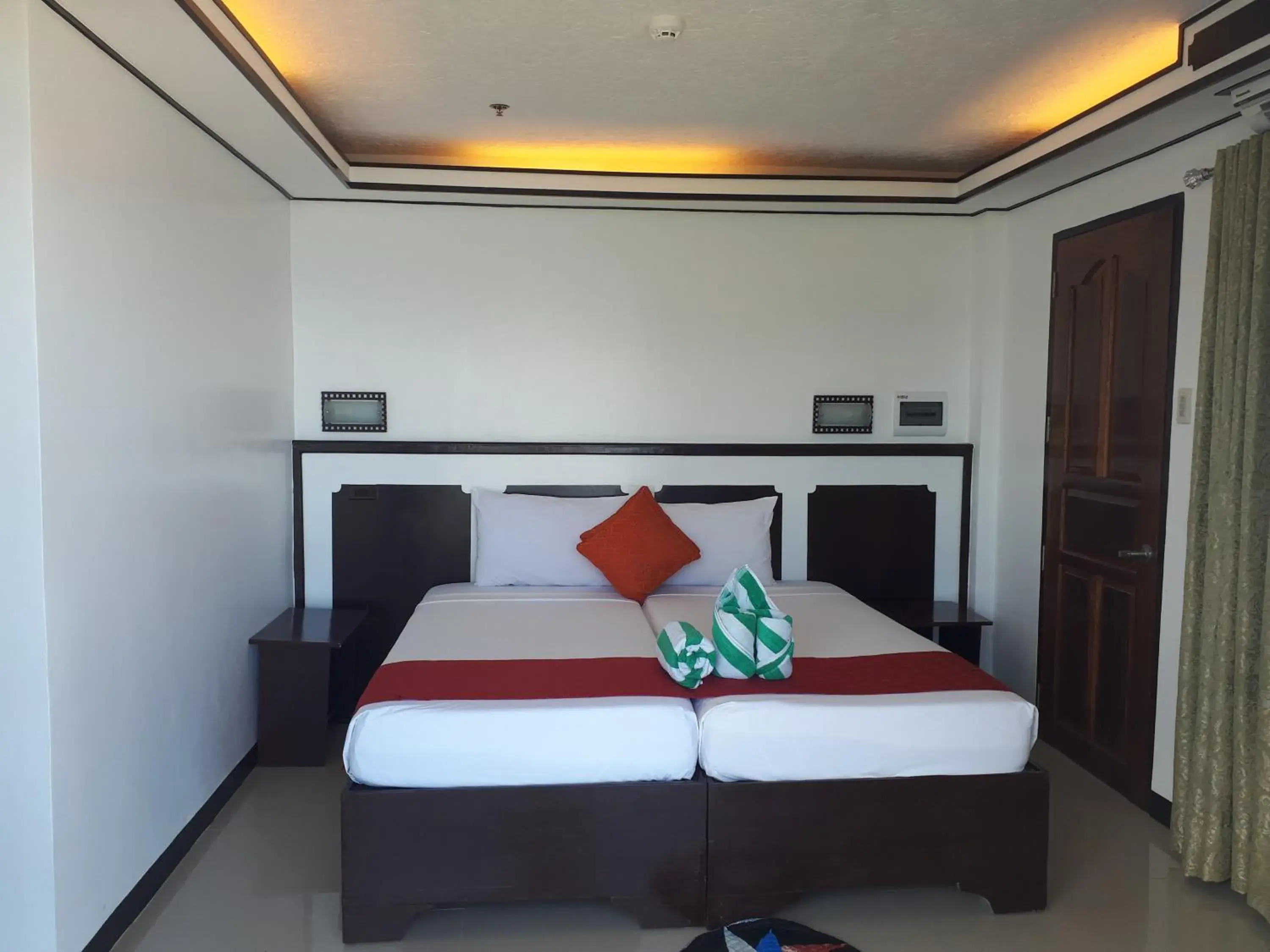 Bed in Orange Pearl Beach Resort