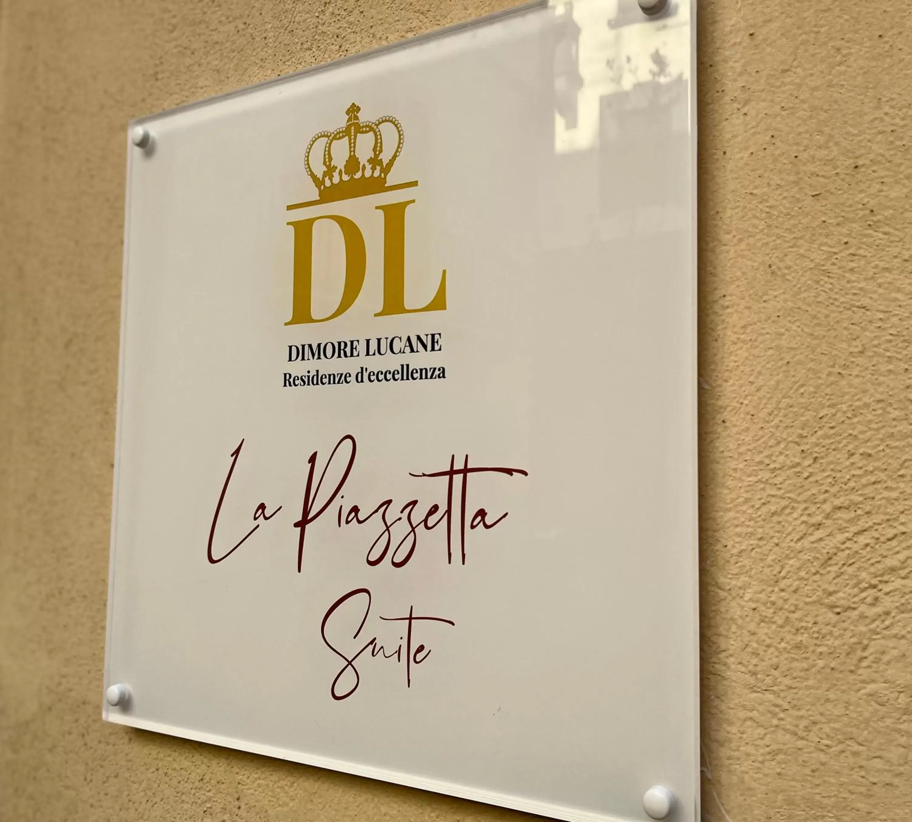 Property logo or sign in La Piazzetta Suite