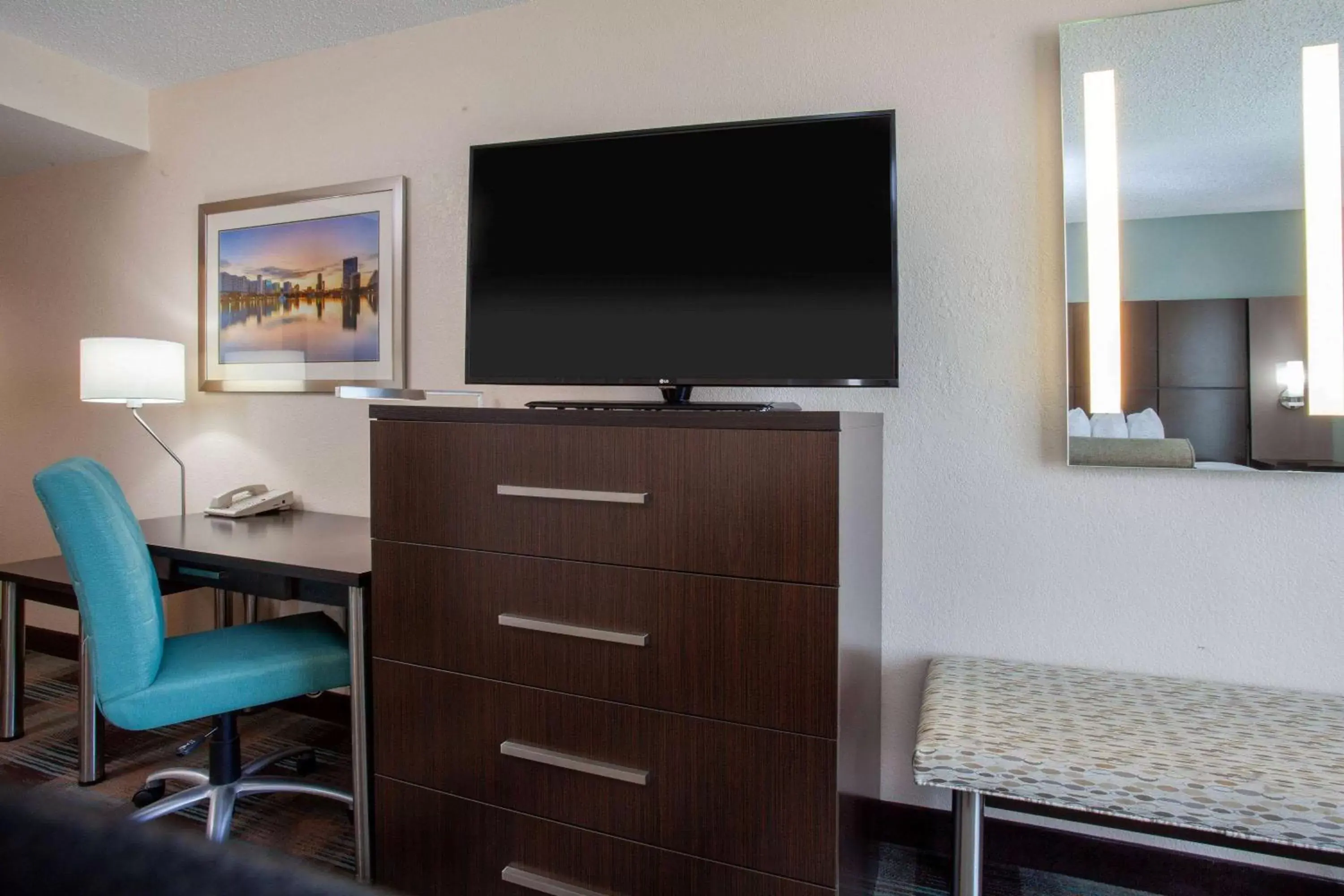 Photo of the whole room, TV/Entertainment Center in Wingate By Wyndham - Orlando International Airport