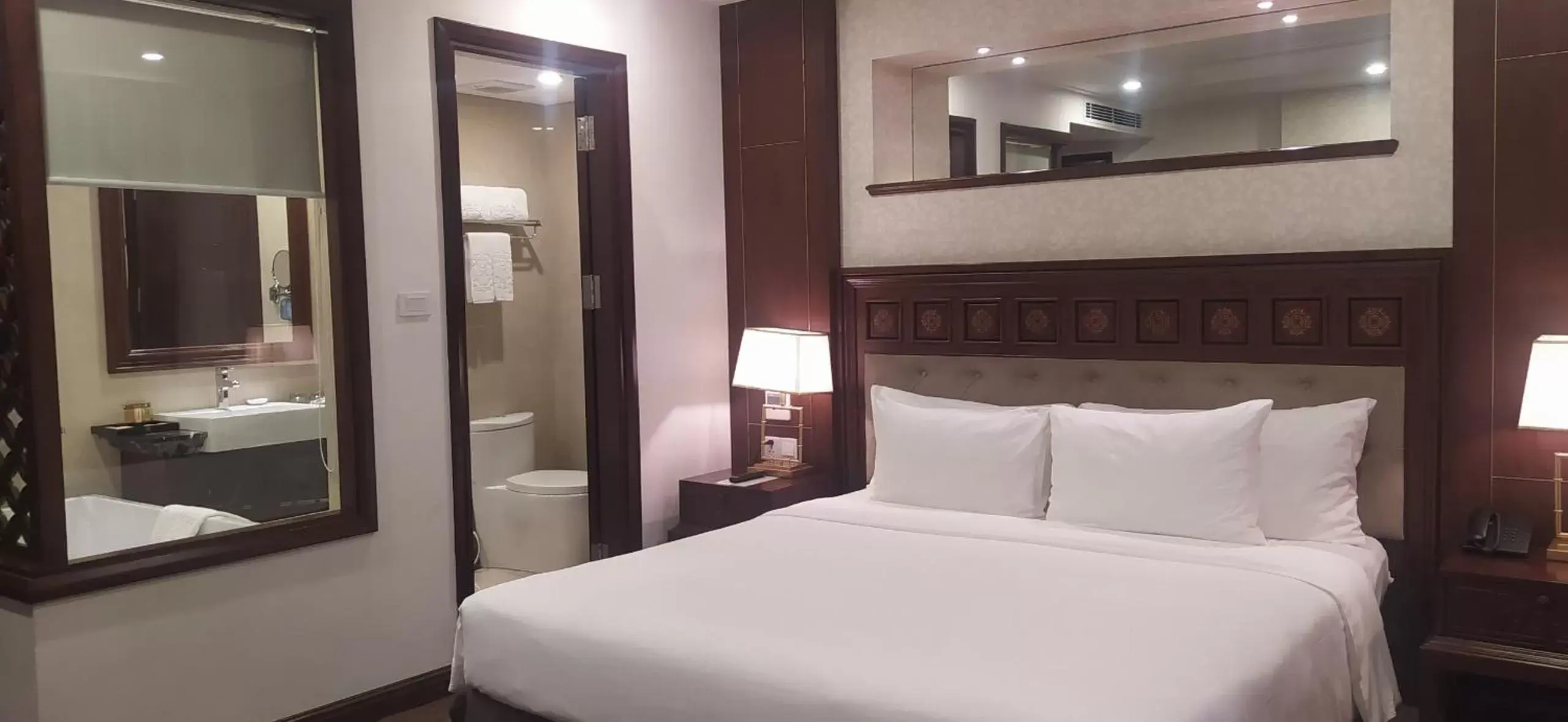 Bed in Rex Hanoi Hotel