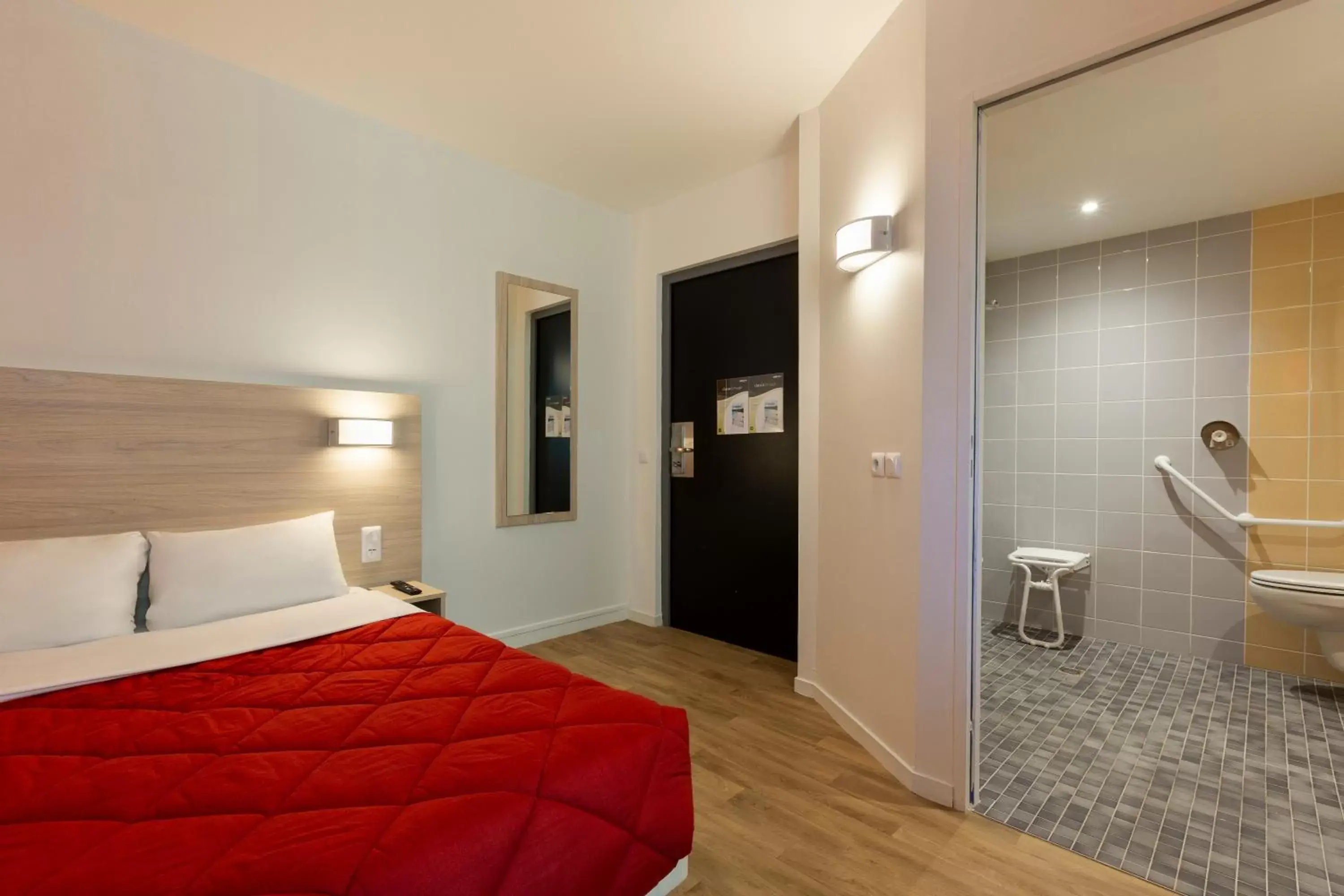 Bedroom, Bed in Premiere Classe Nantes Ouest - St Herblain