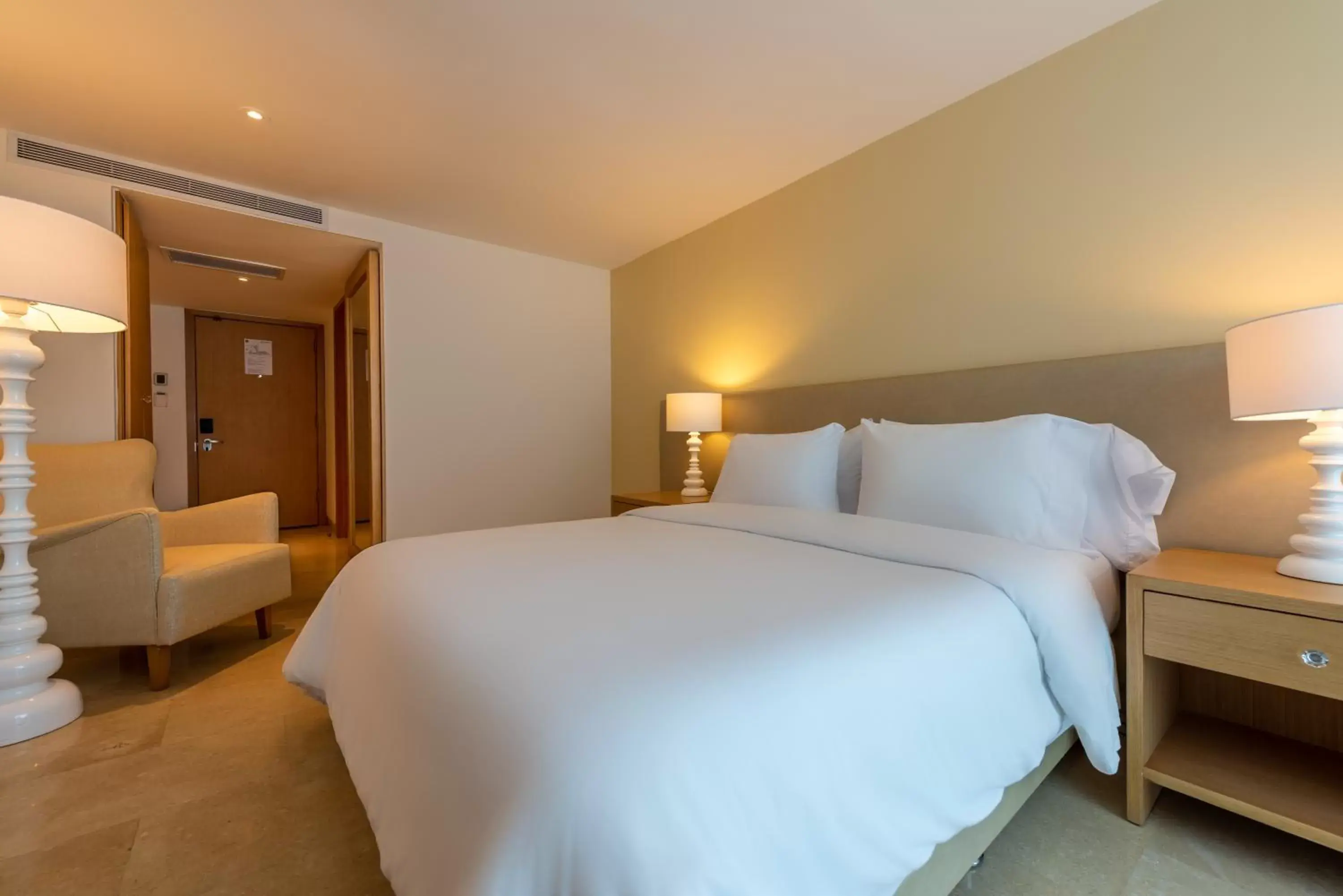 Bed in Radisson Cartagena Ocean Pavillion Hotel
