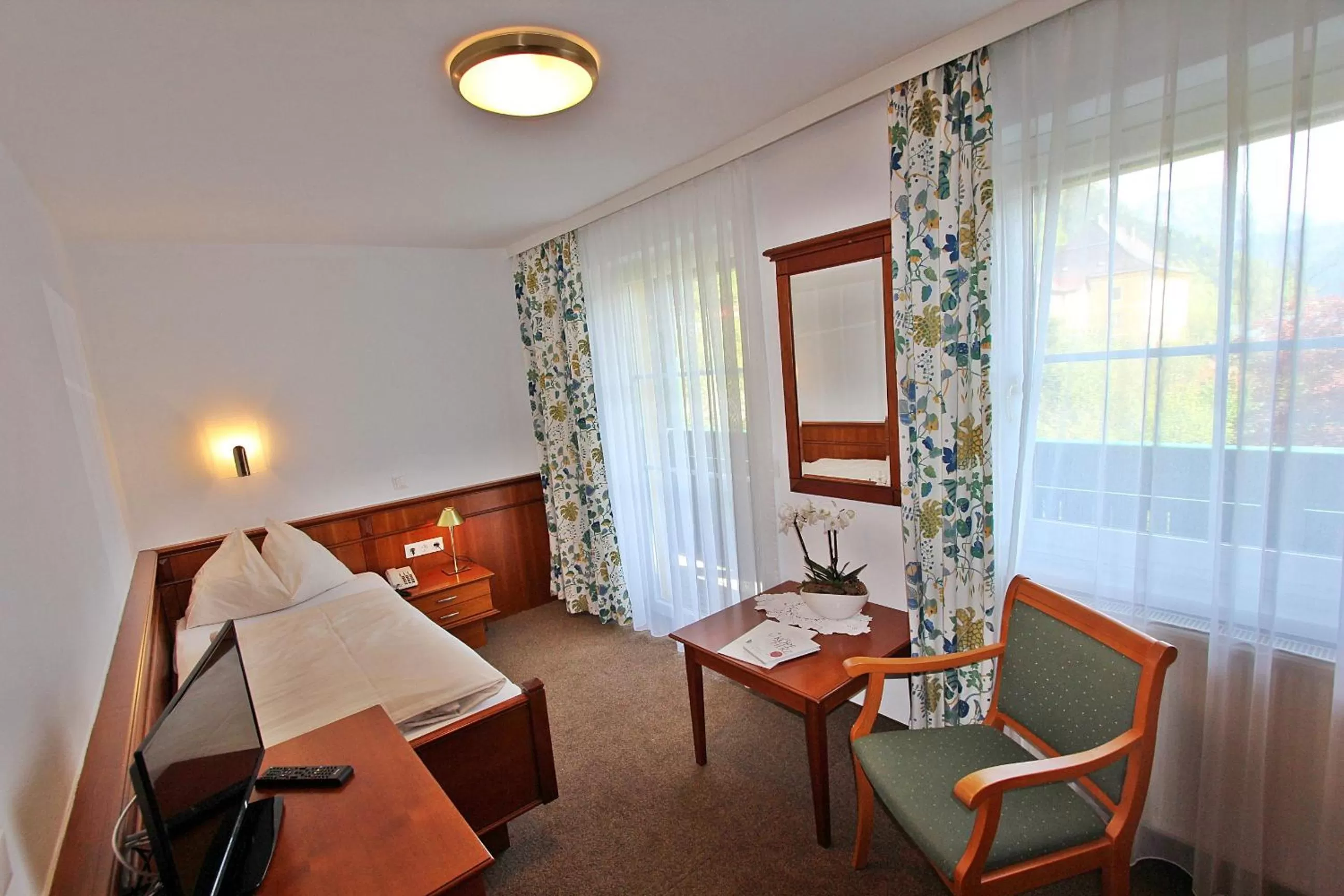 Photo of the whole room, Bed in Landhotel Post Ebensee am Traunsee ***S