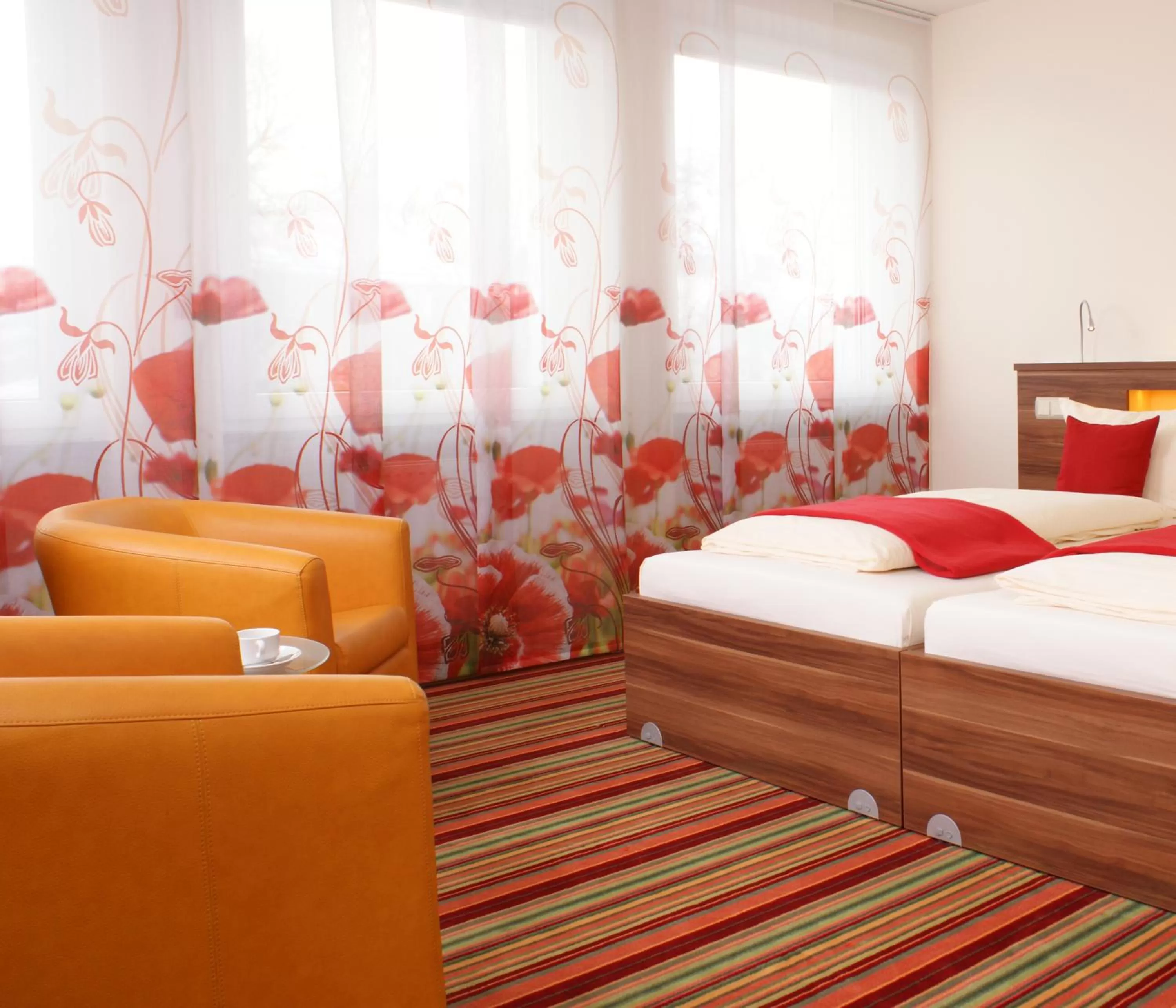 Photo of the whole room, Bed in Hotel Peterhof - urban lifestyle Kempten