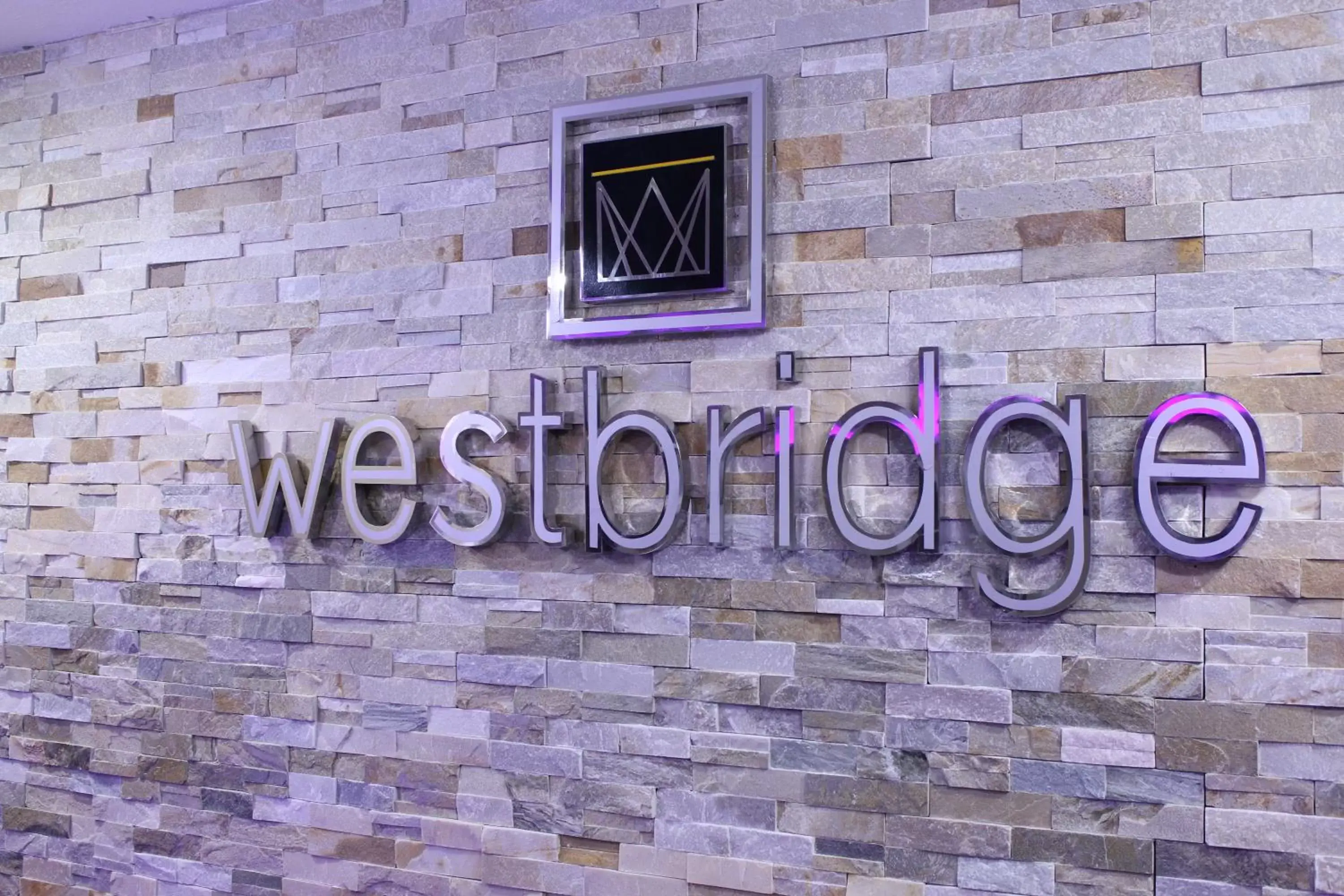 Property logo or sign, Property Logo/Sign in Westbridge Inn & Suites