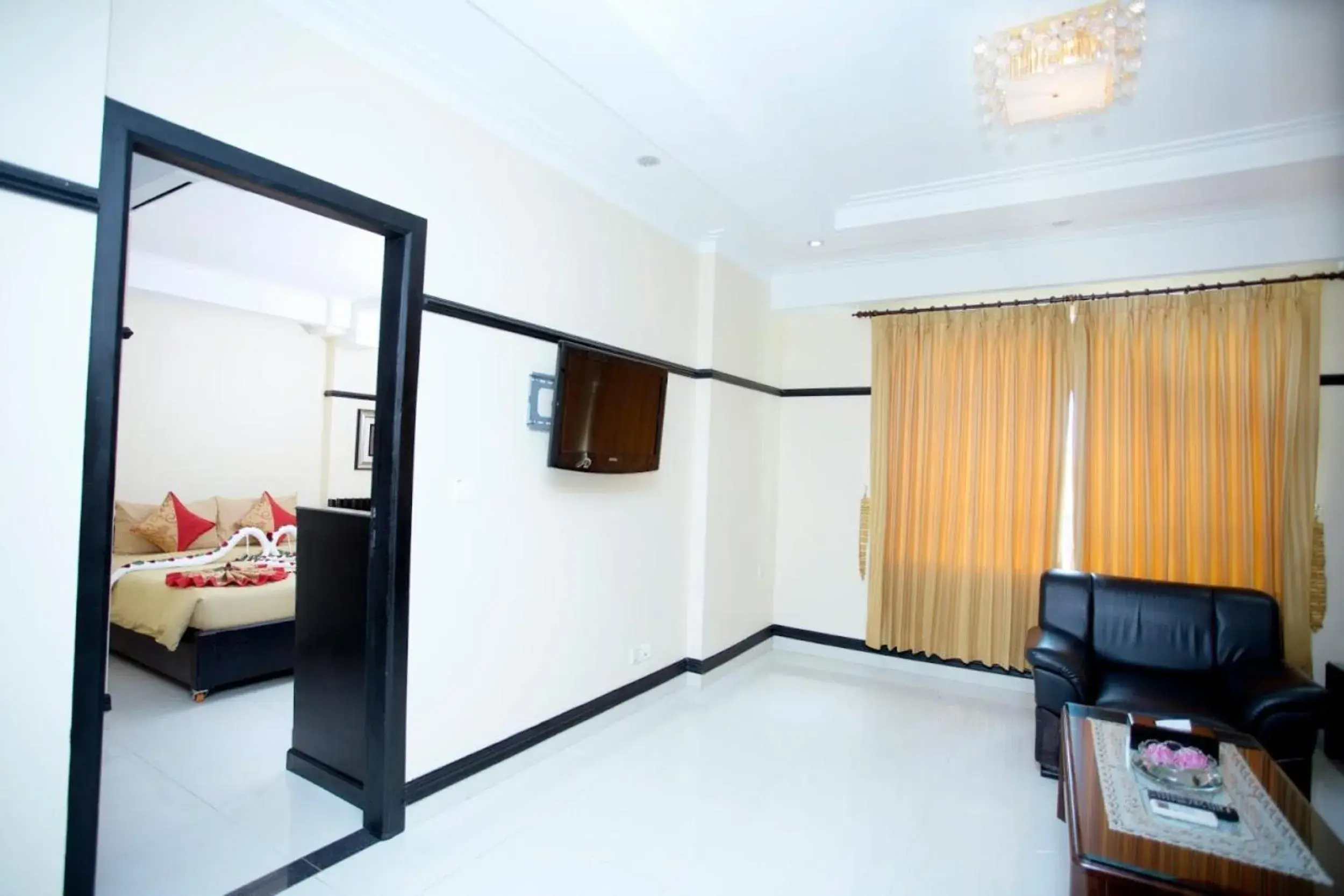 Bedroom, TV/Entertainment Center in Salita Hotel