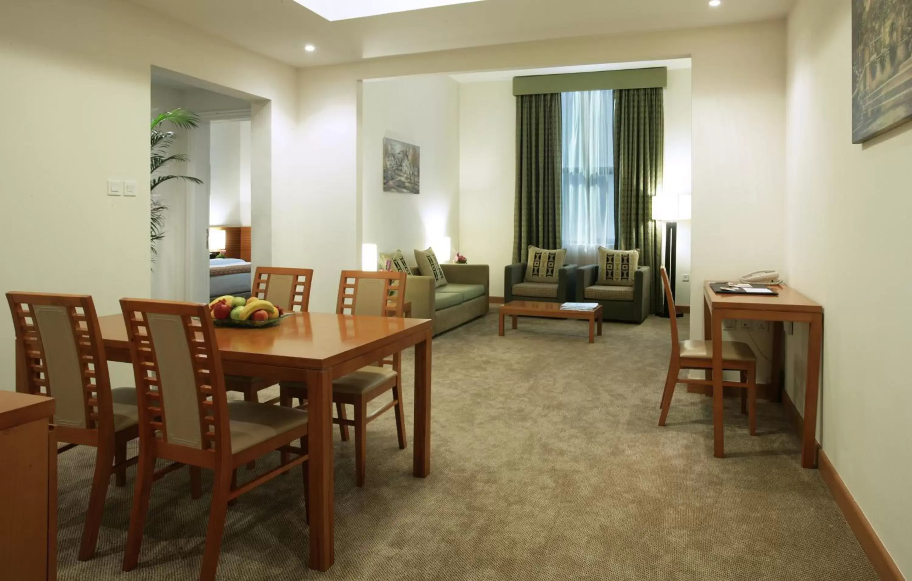 Living room, Dining Area in Ramada Hotel & Suites by Wyndham Ajman