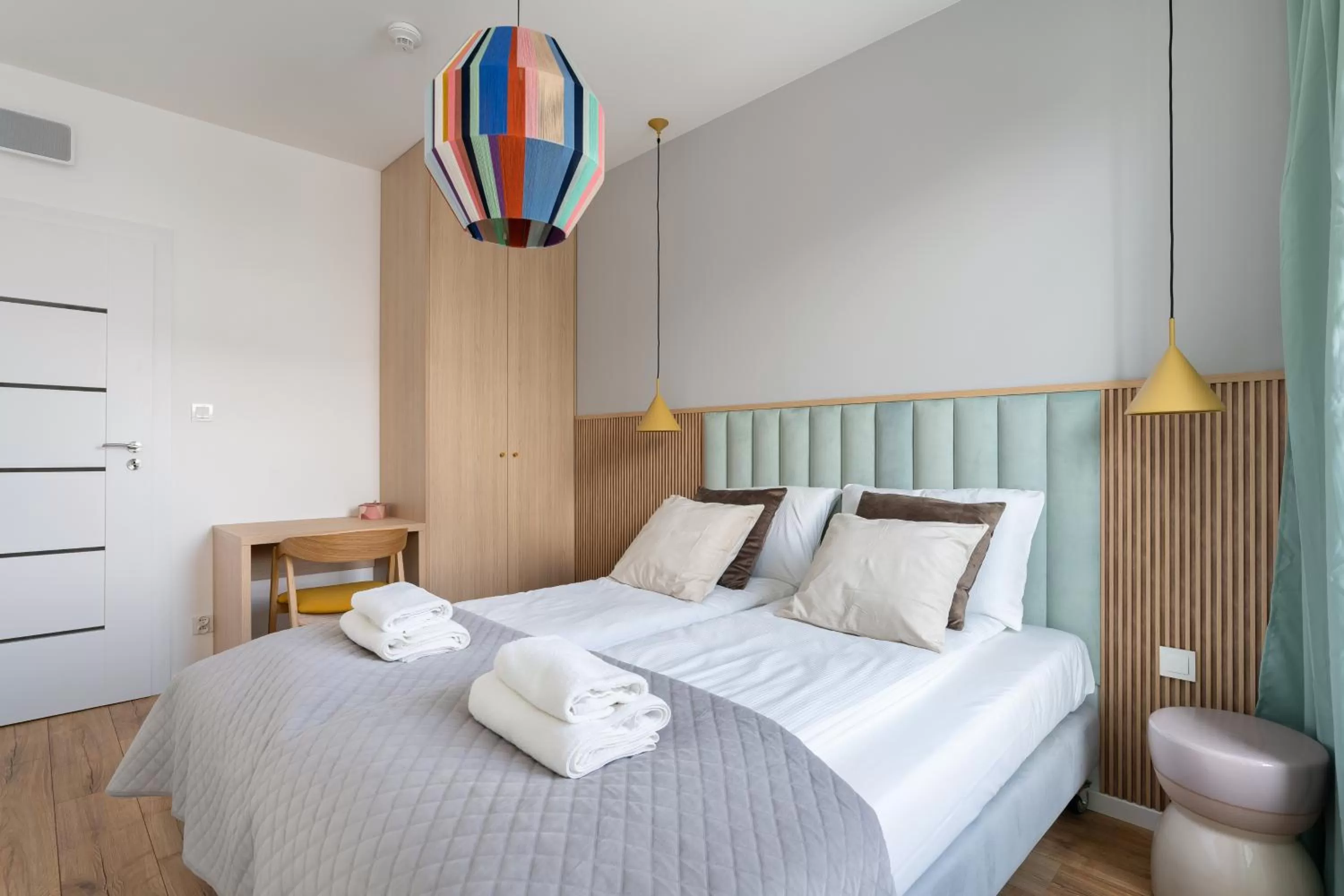 Bed in Symphony Modern Tower Apartamenty