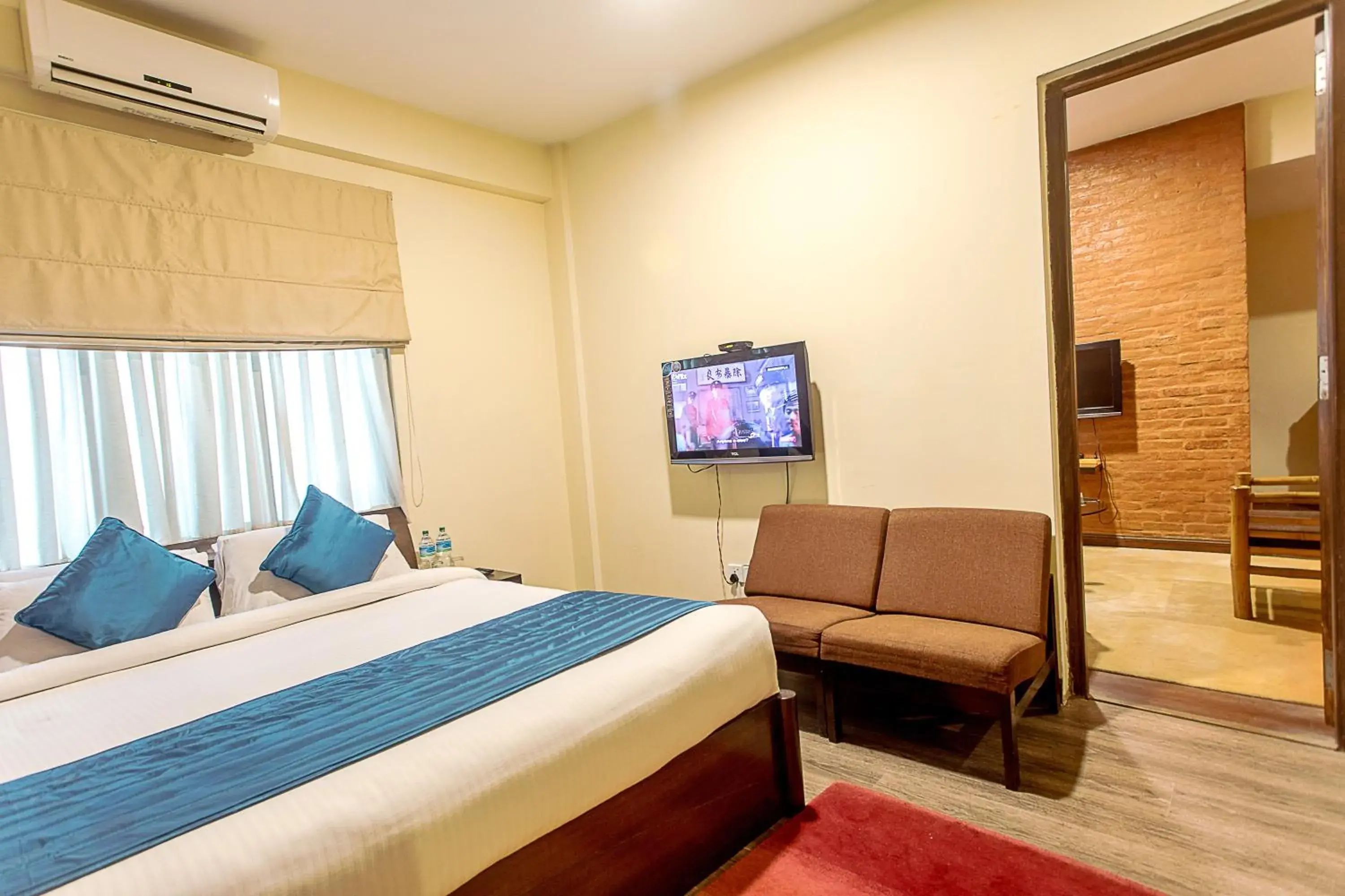 air conditioner, Bed in Gaju Suite Hotel