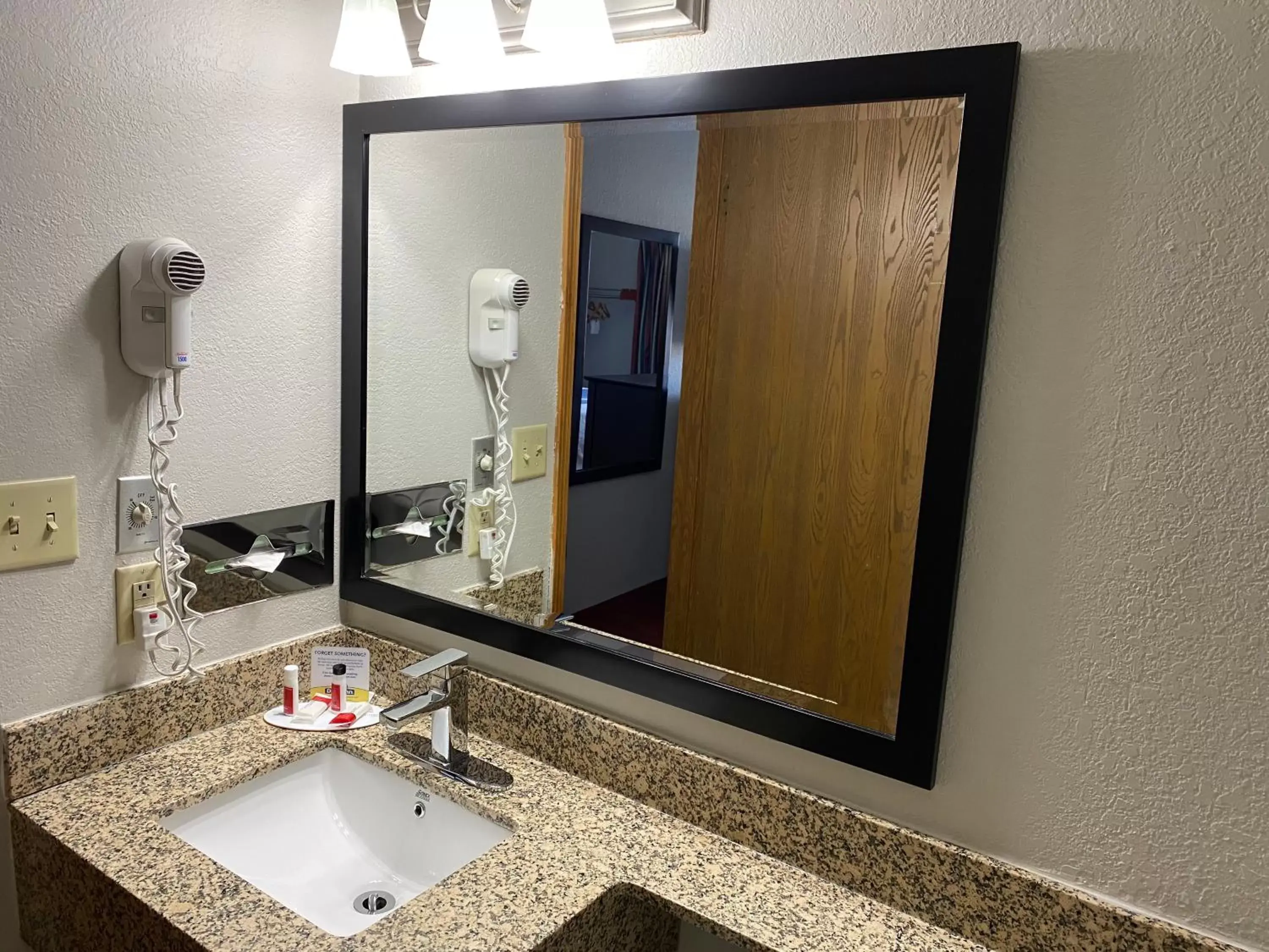 Bathroom in Days Inn & Suites by Wyndham Des Moines Airport