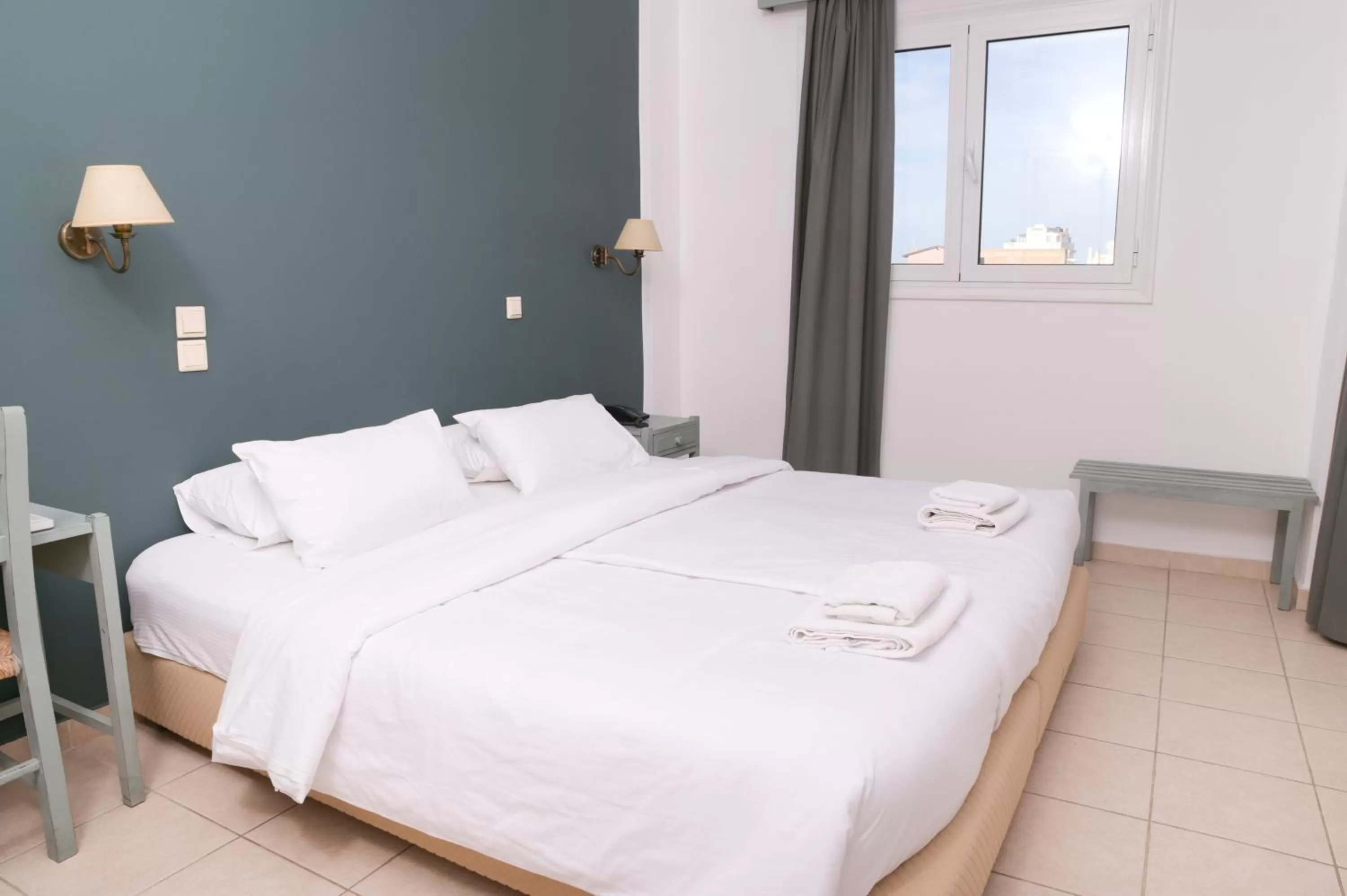 Bed in Ikaros Art Hotel