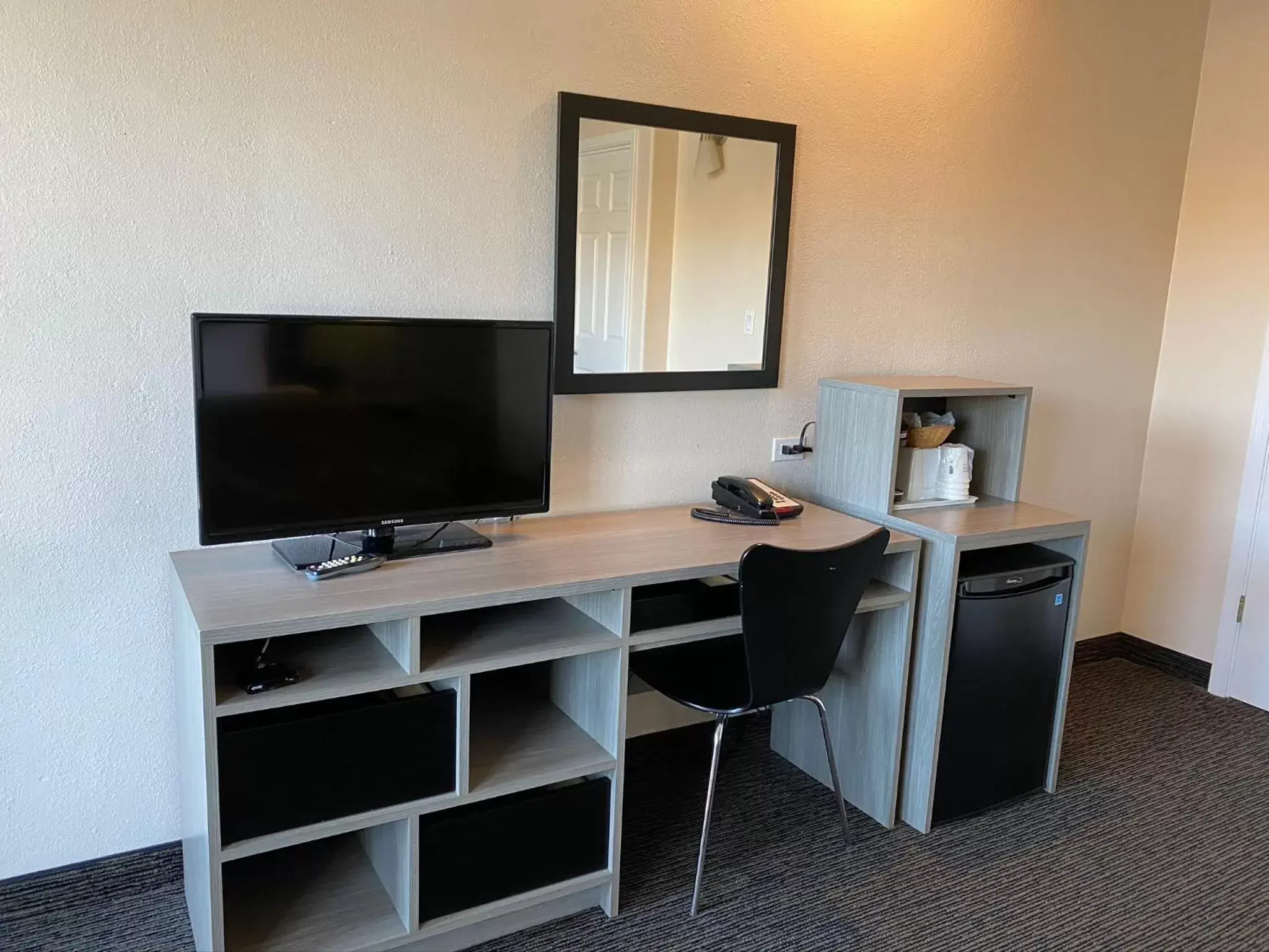 Photo of the whole room, TV/Entertainment Center in Super 8 by Wyndham Monterey