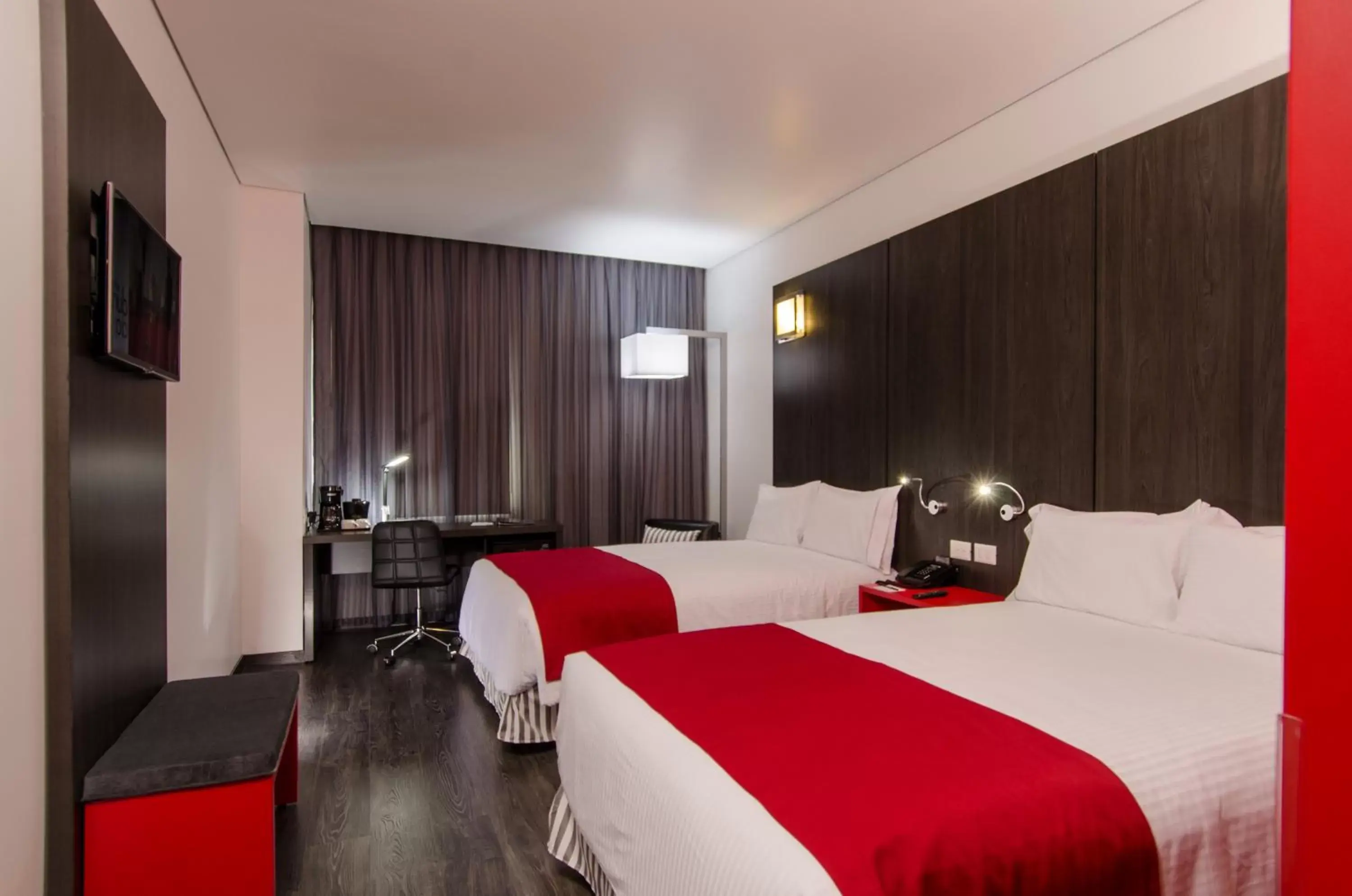 Bed in Ramada Encore by Wyndham Puebla