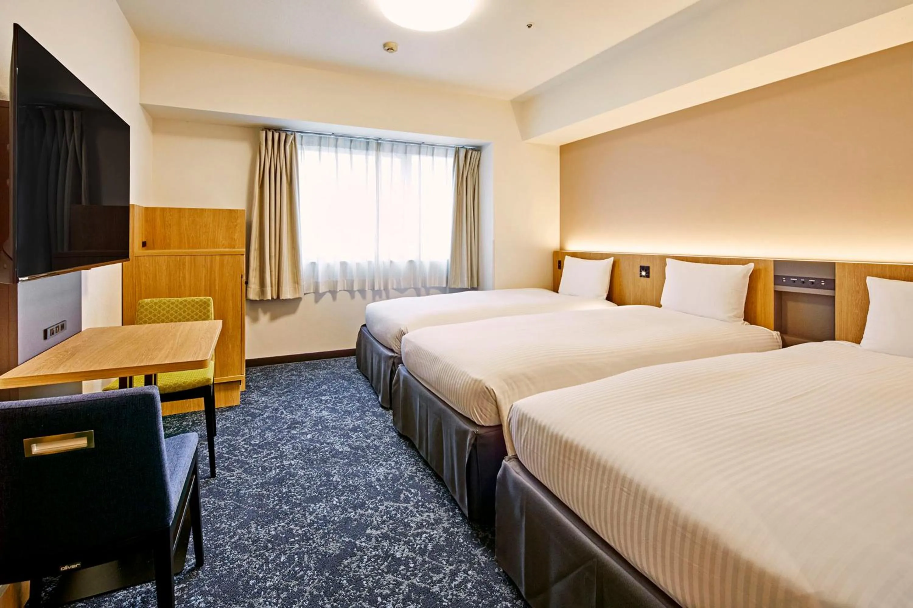 Bed in Hotel Lumiere Kasai