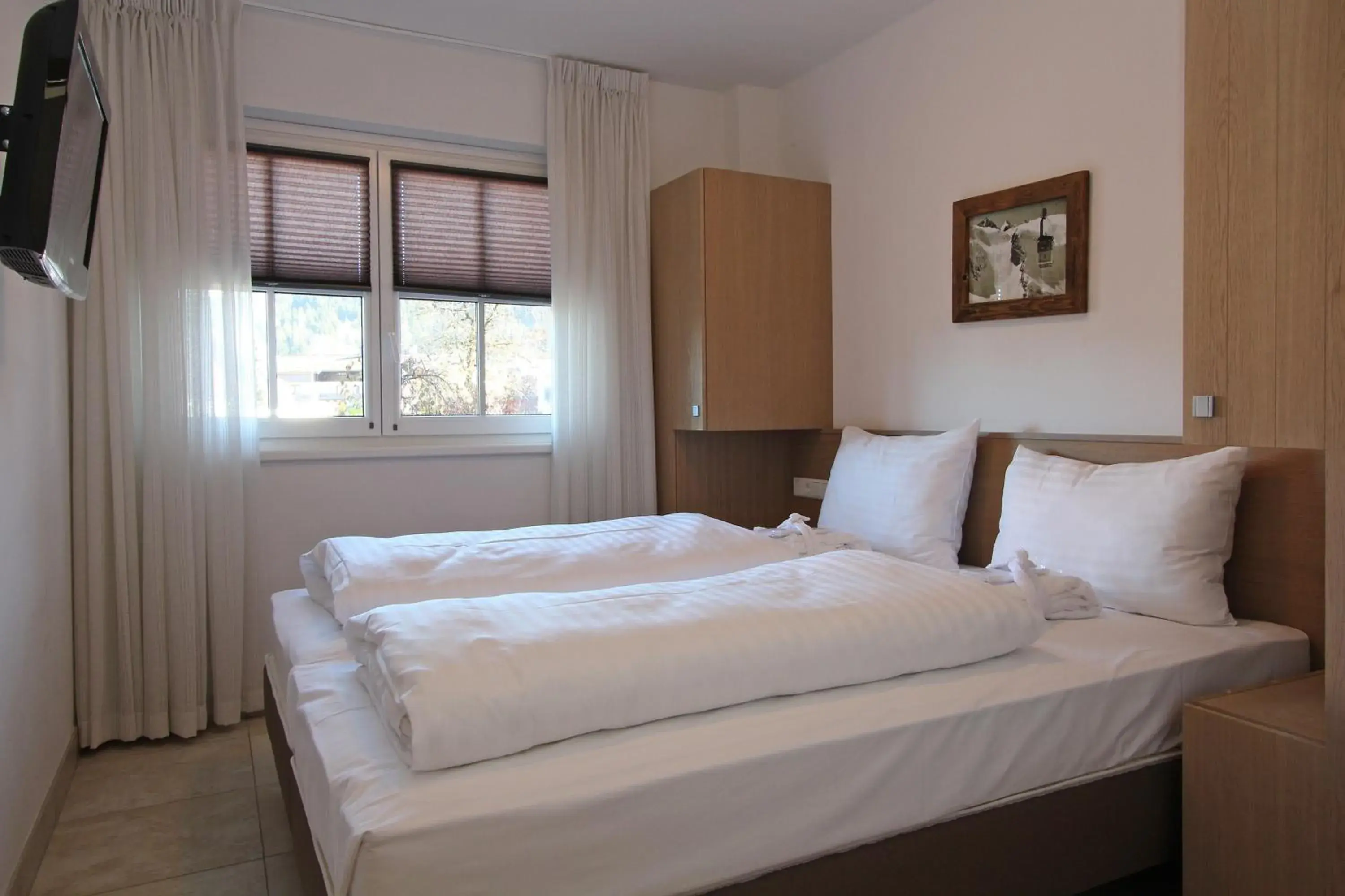 Bed in Avenida Mountain Resort by Alpin Rentals