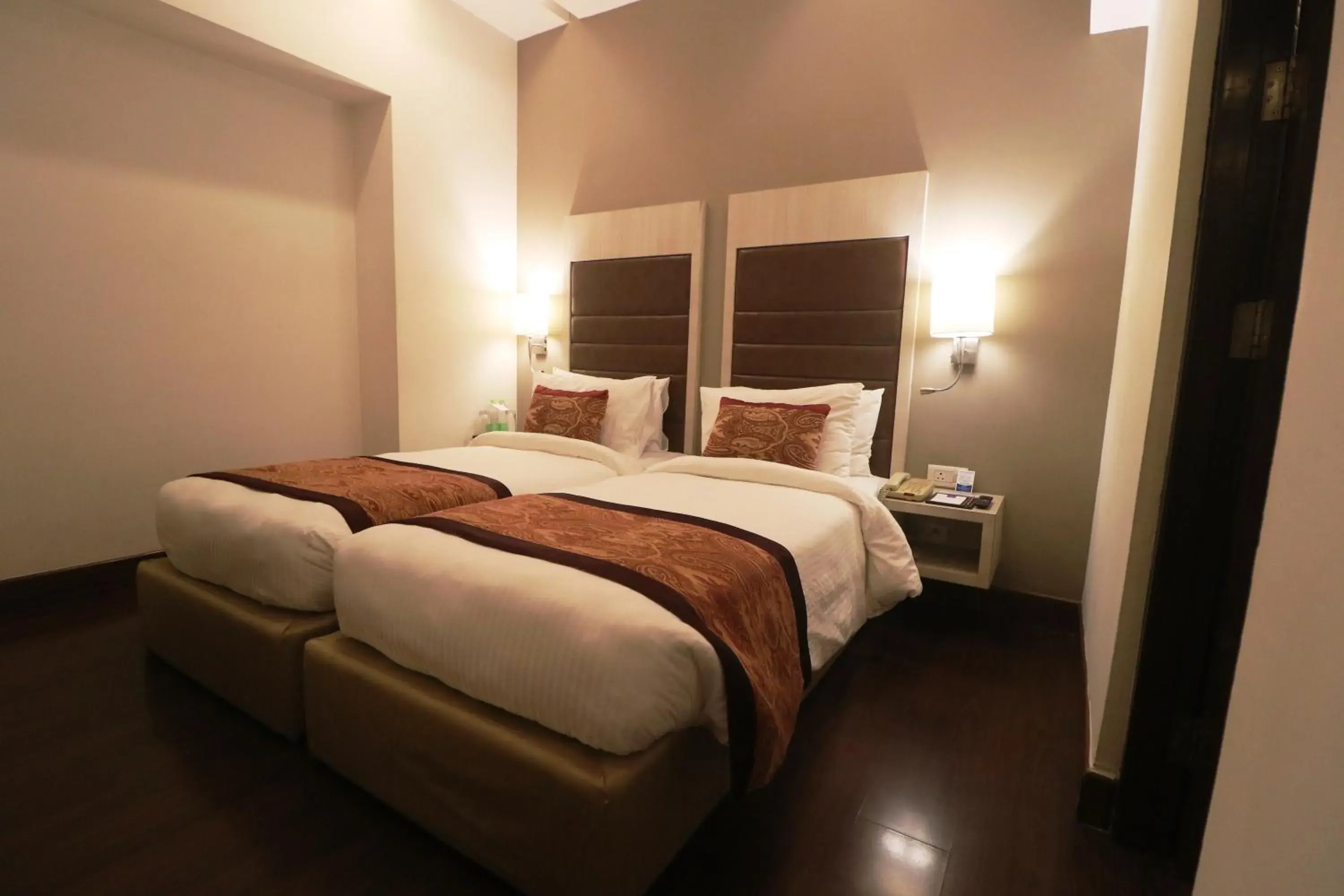 Bed in Mahagun Sarovar Portico Suites Ghaziabad