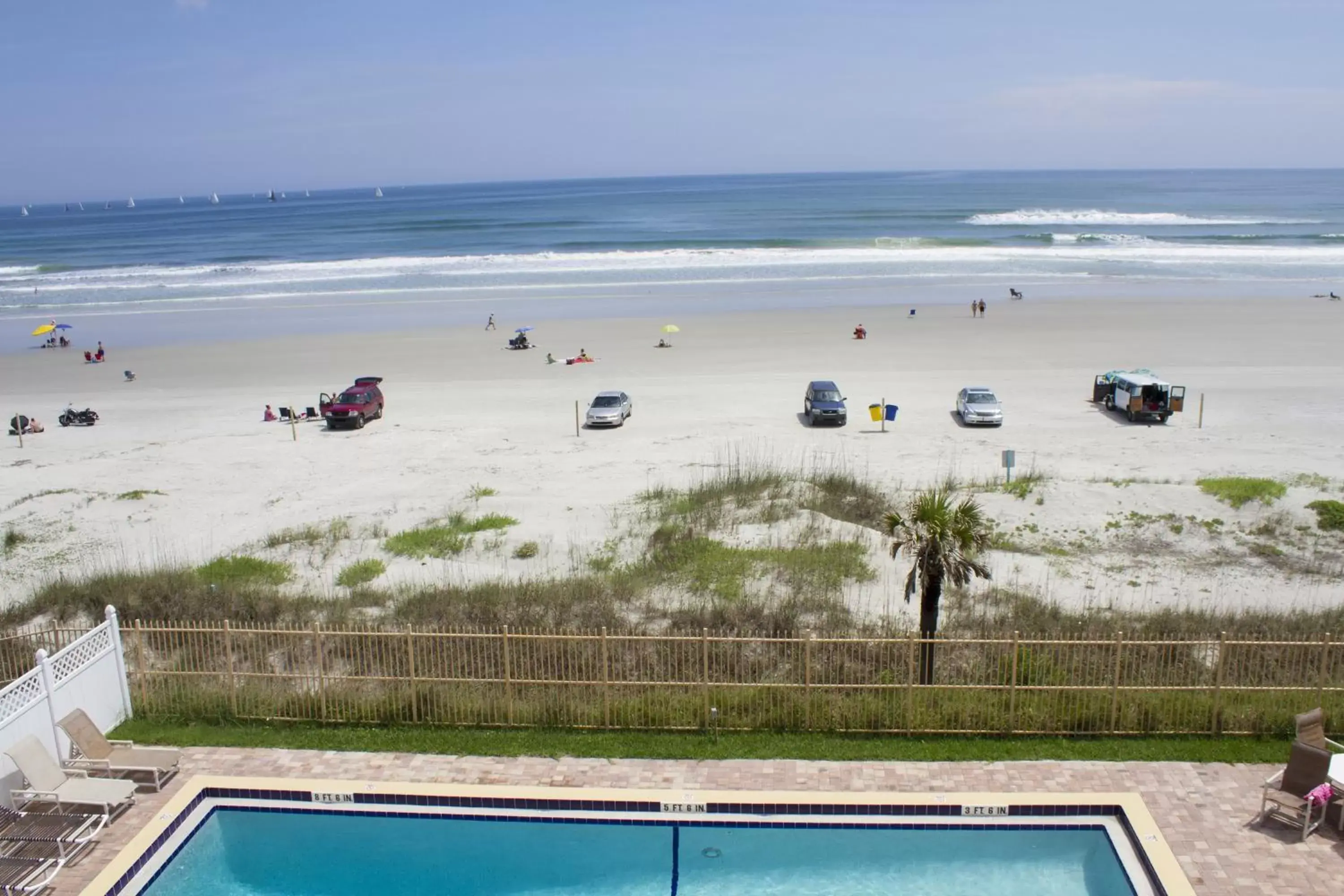 Day, Beach in New Smyrna Waves by Exploria Resorts