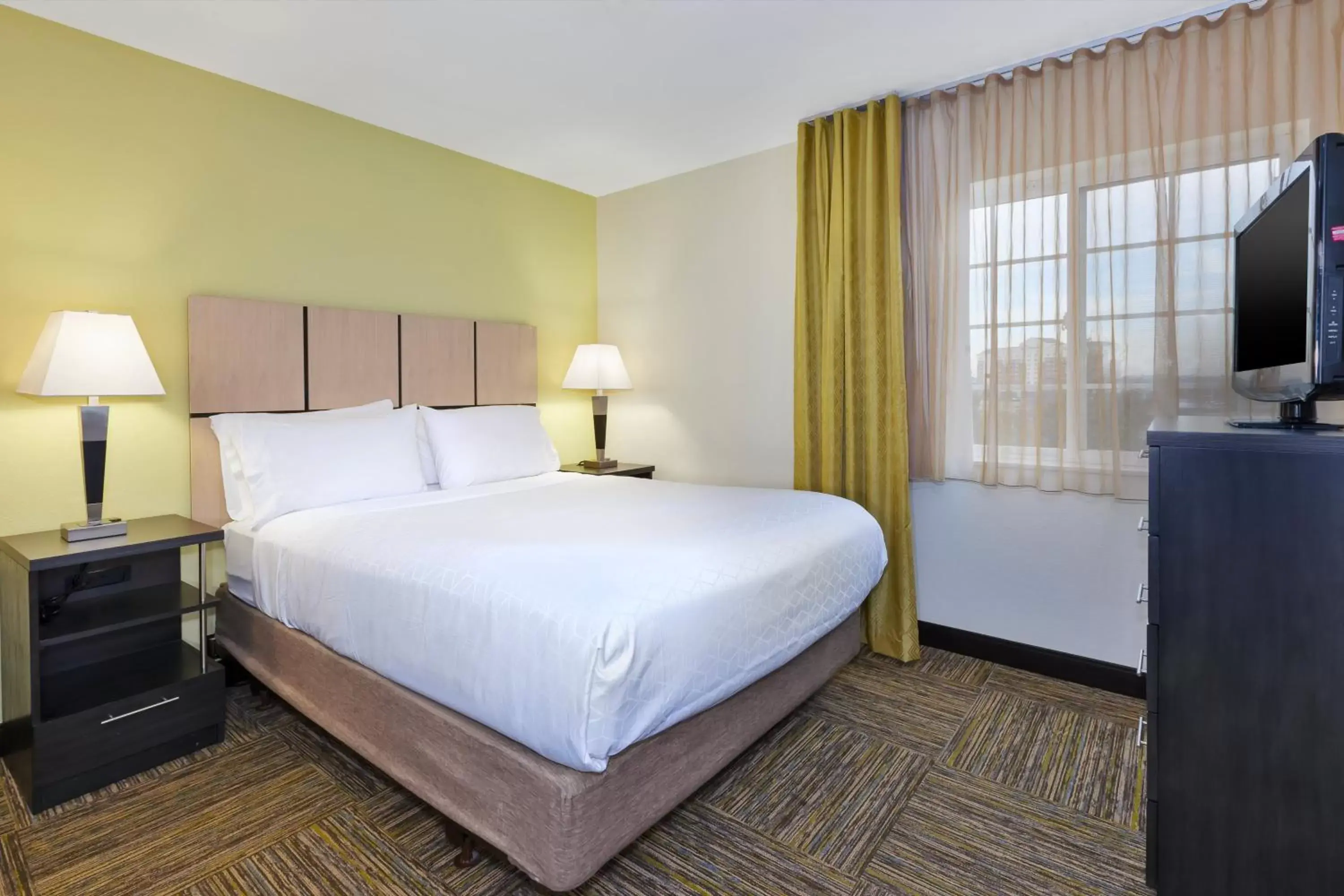 Photo of the whole room, Bed in Candlewood Suites Polaris, an IHG Hotel