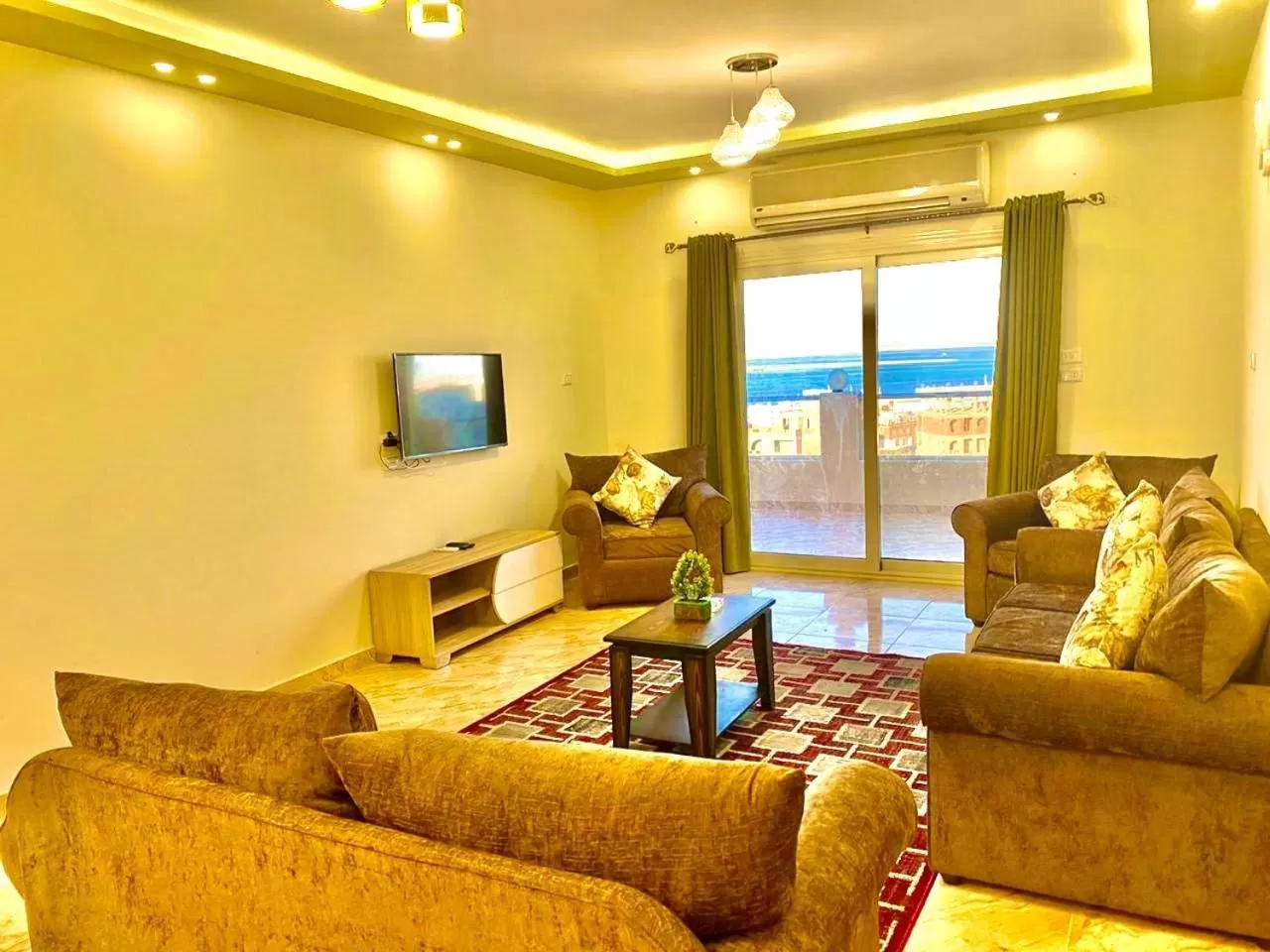 Communal lounge/ TV room, Seating Area in Charbel apartments