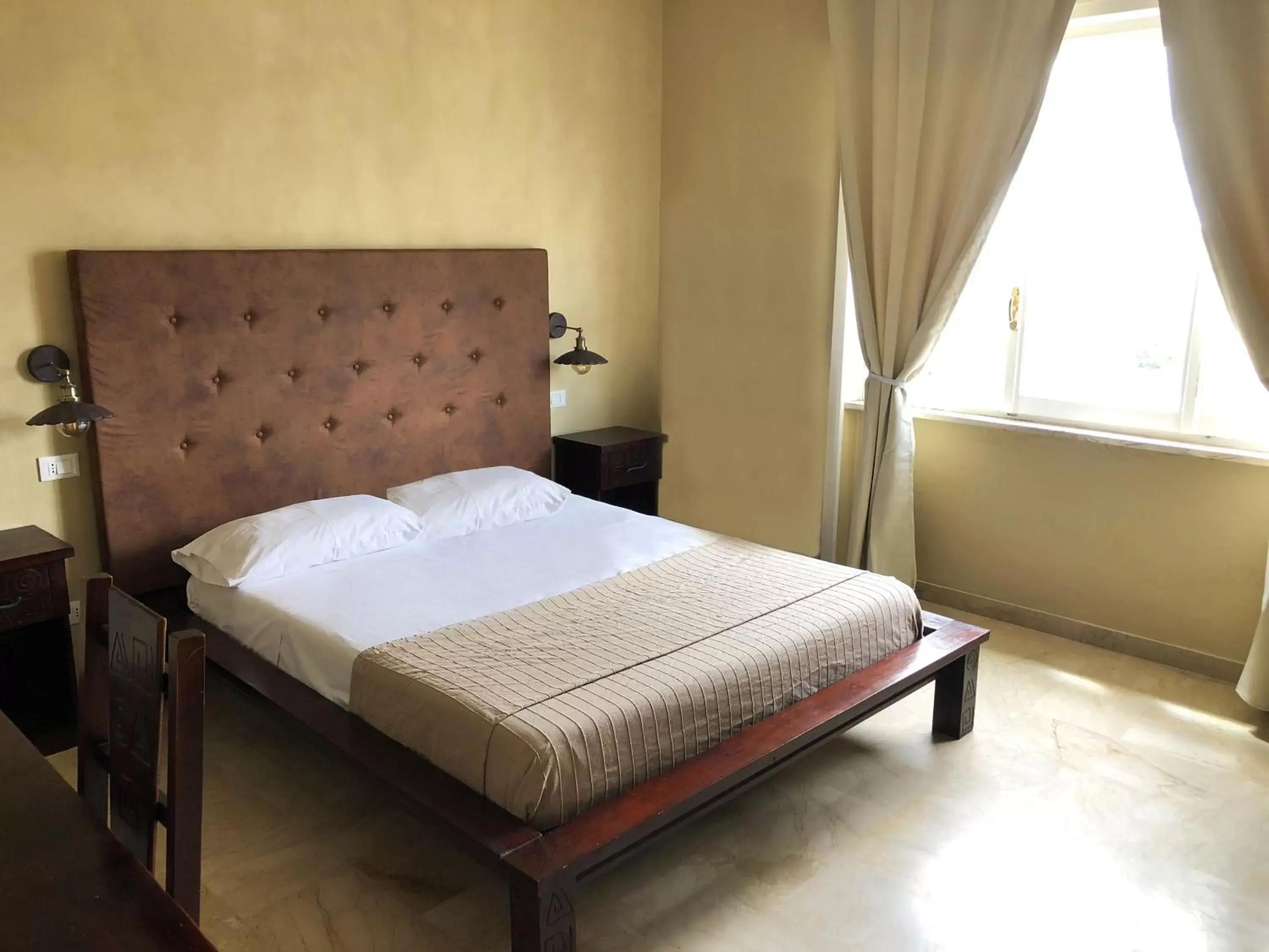 Bed in L'Attico di Piazza Mazzini Rooms