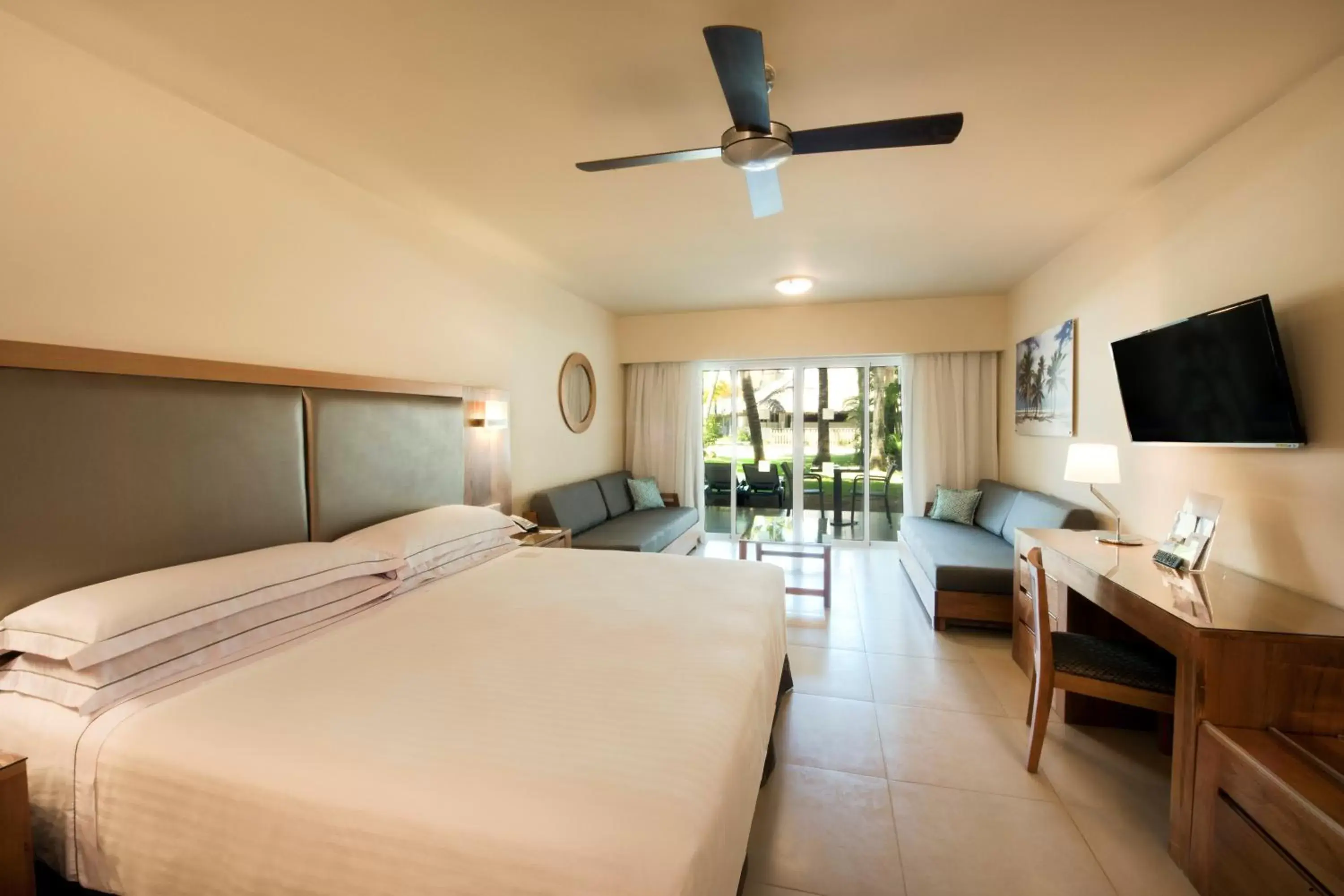 Bed, TV/Entertainment Center in Occidental Punta Cana - All Inclusive
