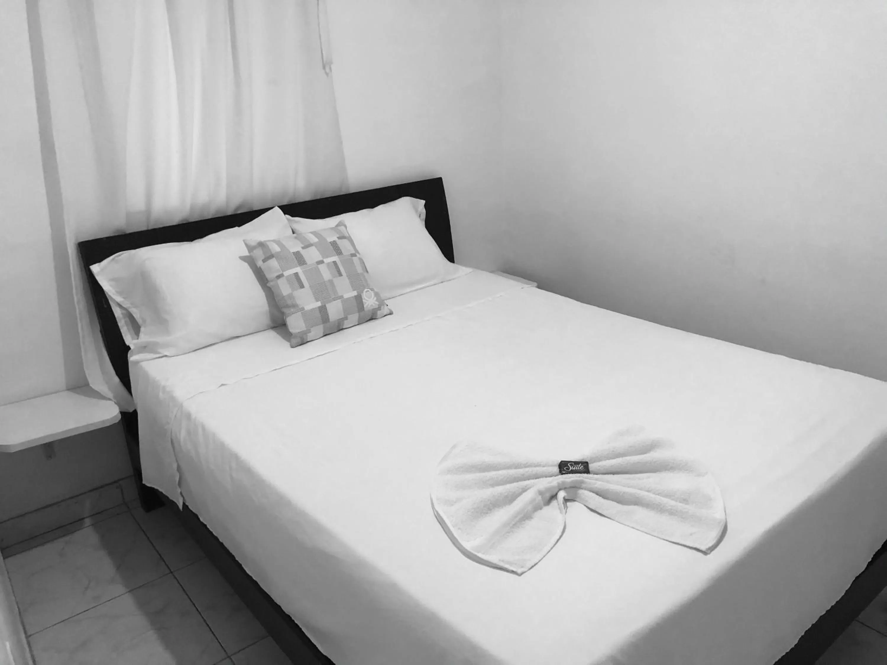 Bed in Tita’s Airport Hotel